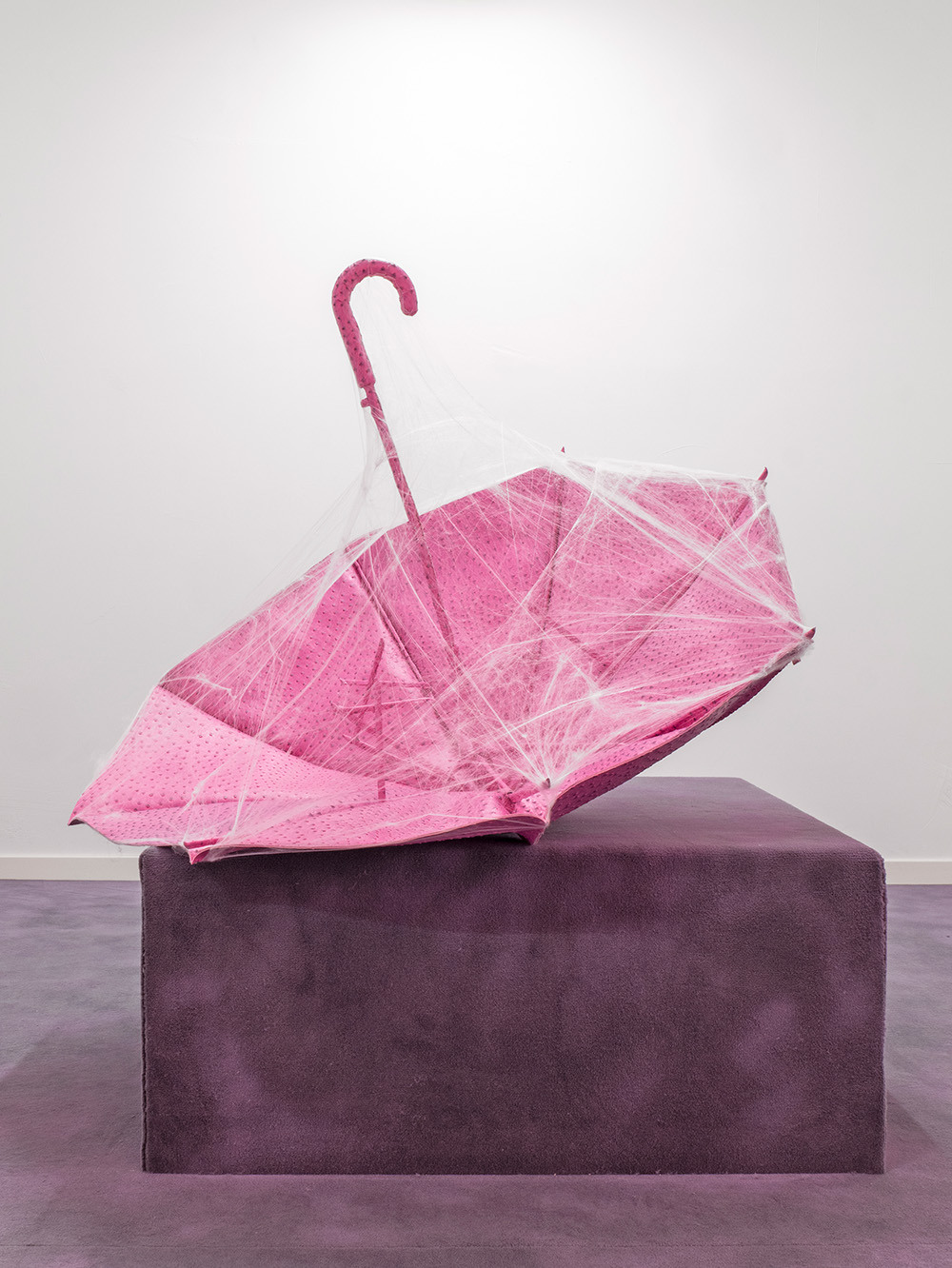 Souvenir; 2022; Faux ostrich skin, umbrella parts, cobwebs; 110 x 110 x 80 cm.