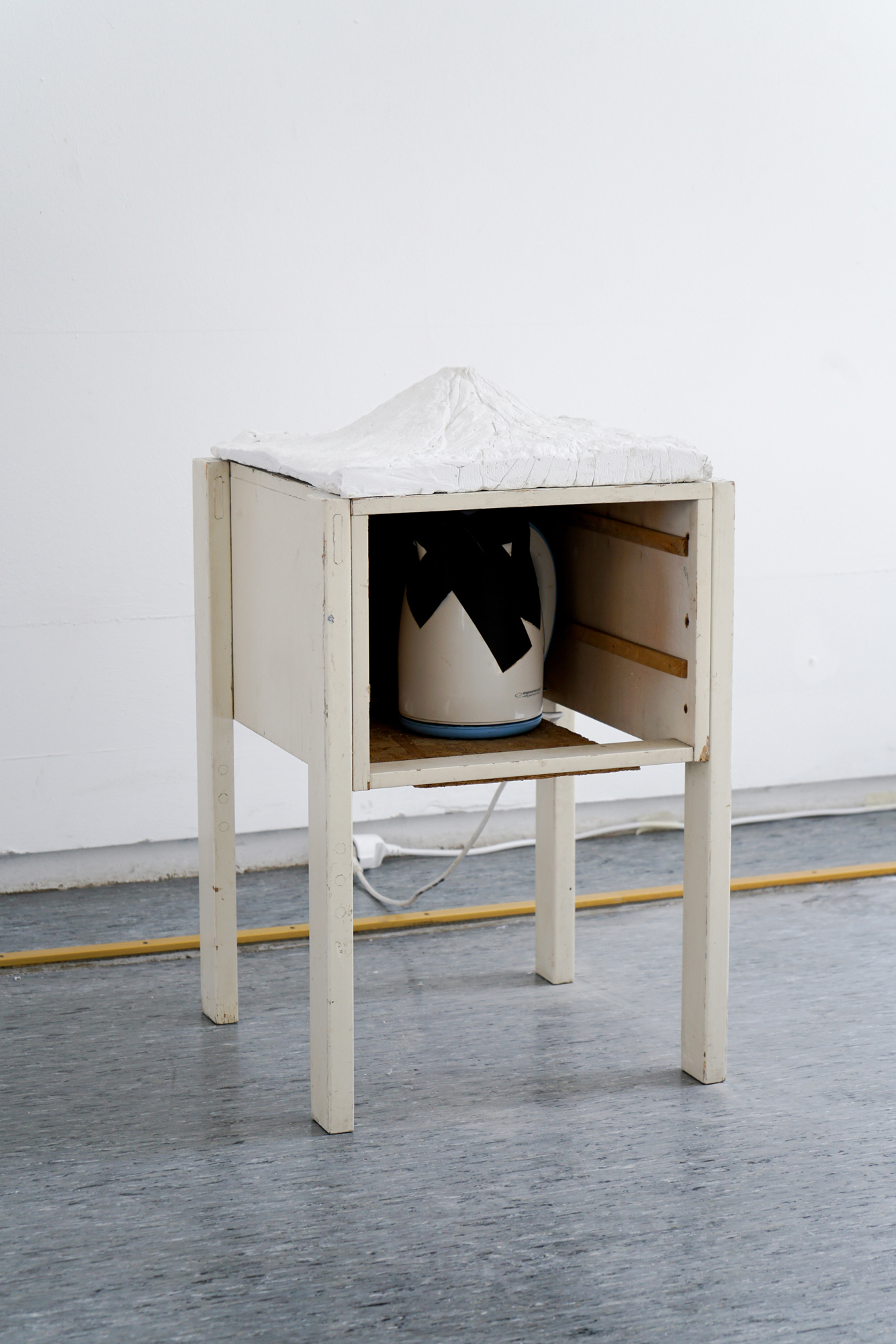 Magda Starska, Volcano, 2012, assisted readymade: sideboard, kettle, plaster