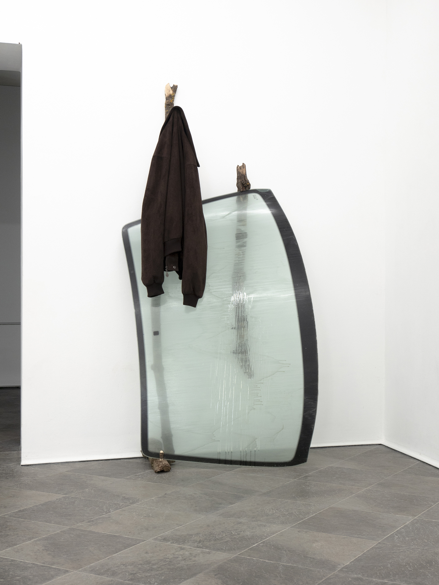 mystic, fogged figure in the distance; 2022; wood, glass, epoxy resin, pigment, jacket; 187 x 94 x 44 cm.