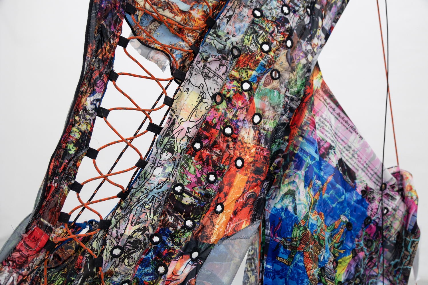 Tanat Teeradakorn & Joe Highton GEOMETRY OF THE DELUSIONAL LAYER ON THE BONE, Dye-sublimation print on fabric, metal, ropes, rocks; 2m x 2m 2022