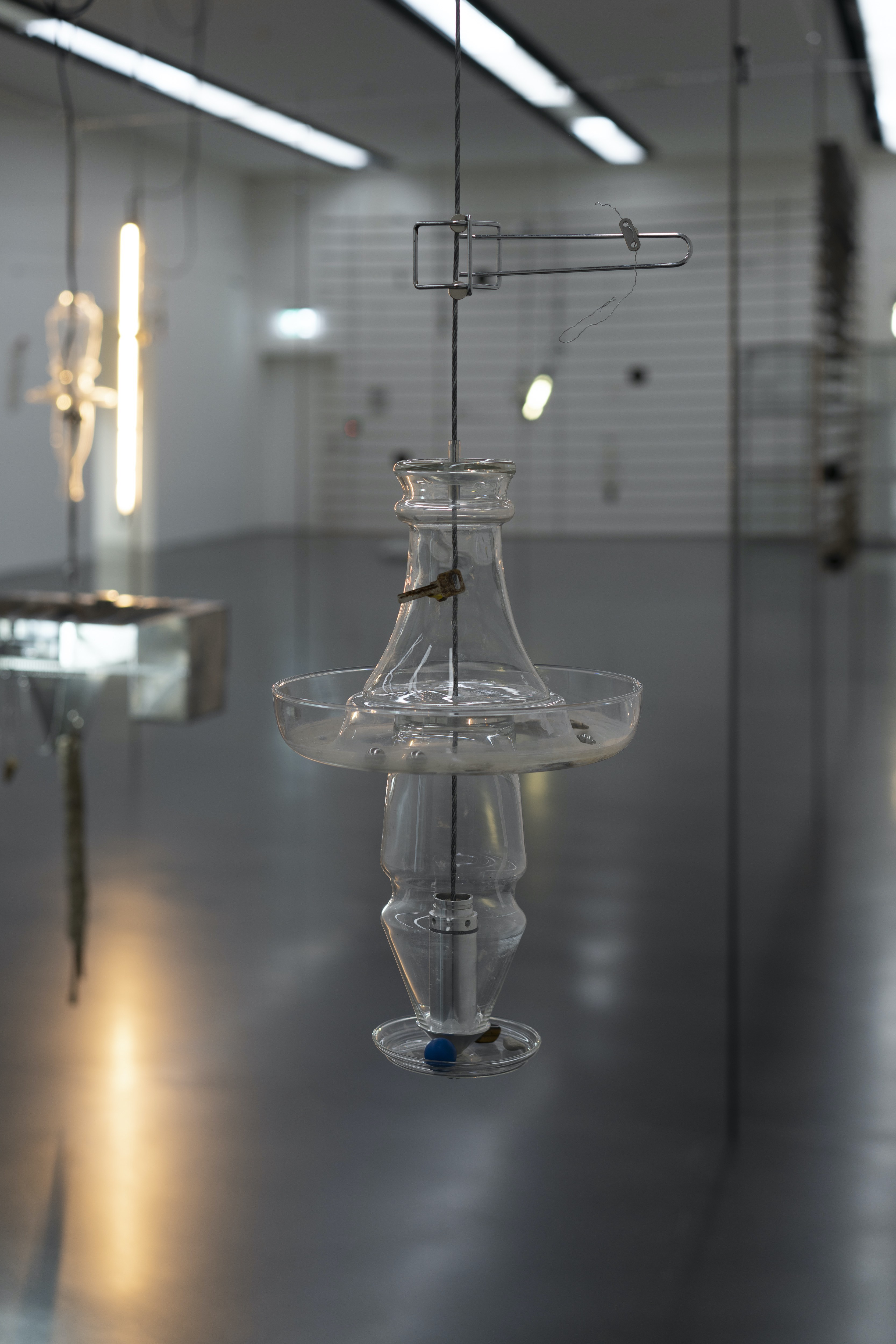 Collector V 2022 Glass, steel cable, found objects, Height approx. 60 cm