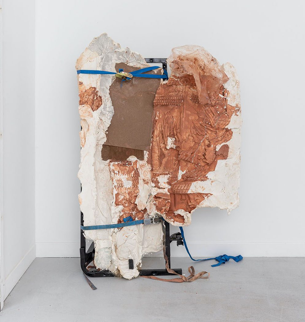 Papa et moi, 2022, fragment of sofa bed, straps, plaster, red clay, 159 x 110 x 60 cm