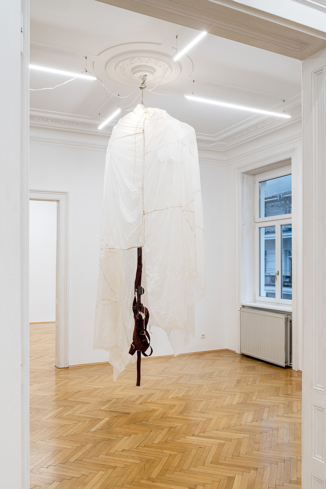 Sergio Verastegui, MÃ©duse 1, 2021, Parachute, iron grid, parachute harness, lamp, electric systemâ€¨, 255 x 107 x 107 cm, Copyright: Simon Veres, Courtesy of the Artist + ZVA