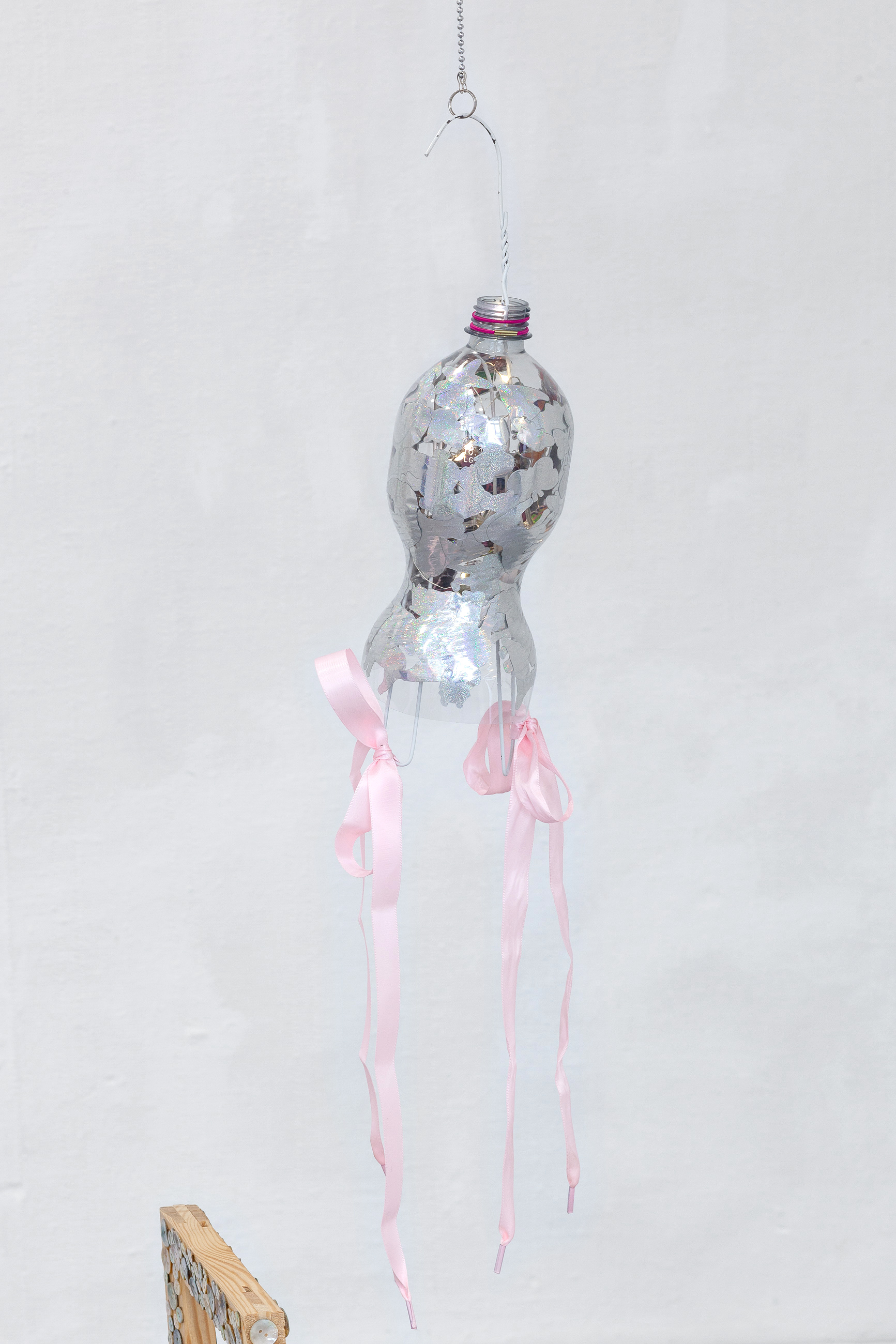 08. Paula Linke, Young women with fewer rights than their mothers and grandmothers, plastic bottle, sticker, led lights, hanger, shoelaces, 2022