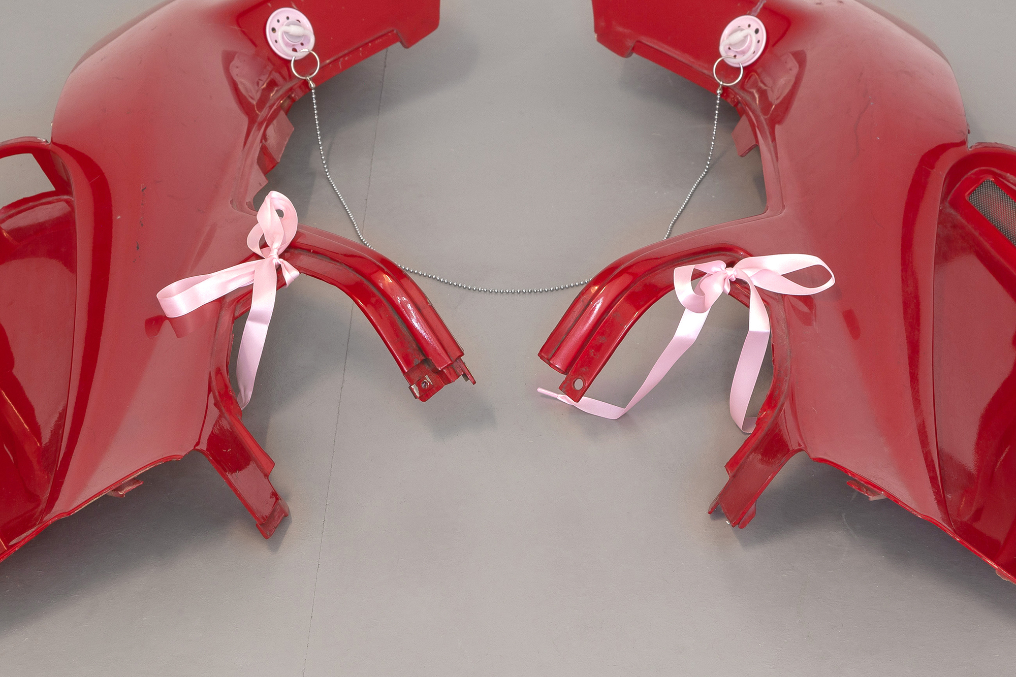 13. Paula Linke, Red Hot Lovers, scooter fairing, pacifier, ball chain, shoelaces, 2022 (Detail)