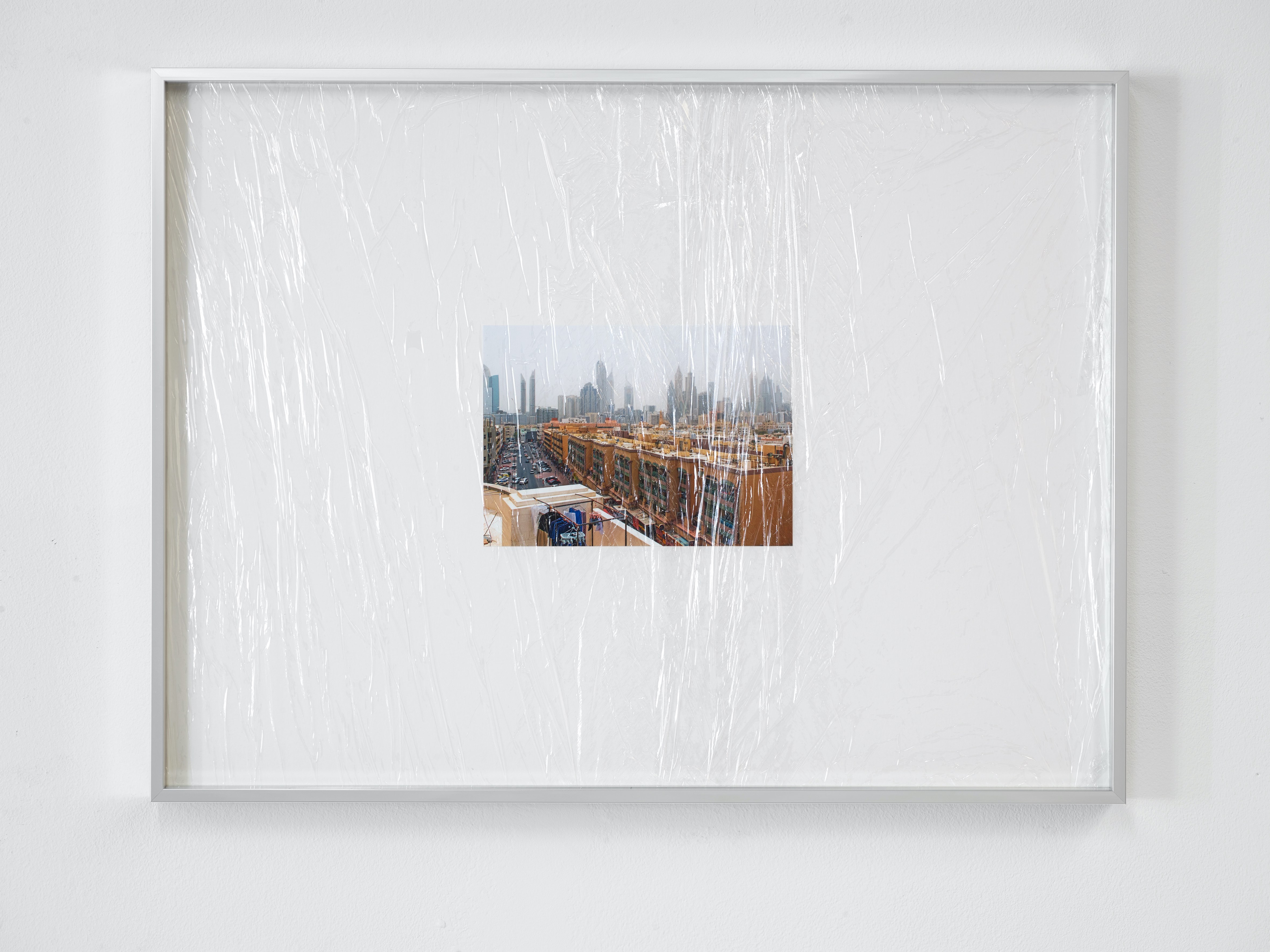 Al Satwa Balikbayan (Dubai) 2022 digital print, cling film wrapping, archival card, aluminum frame 42,5 Ă 56,5 cm