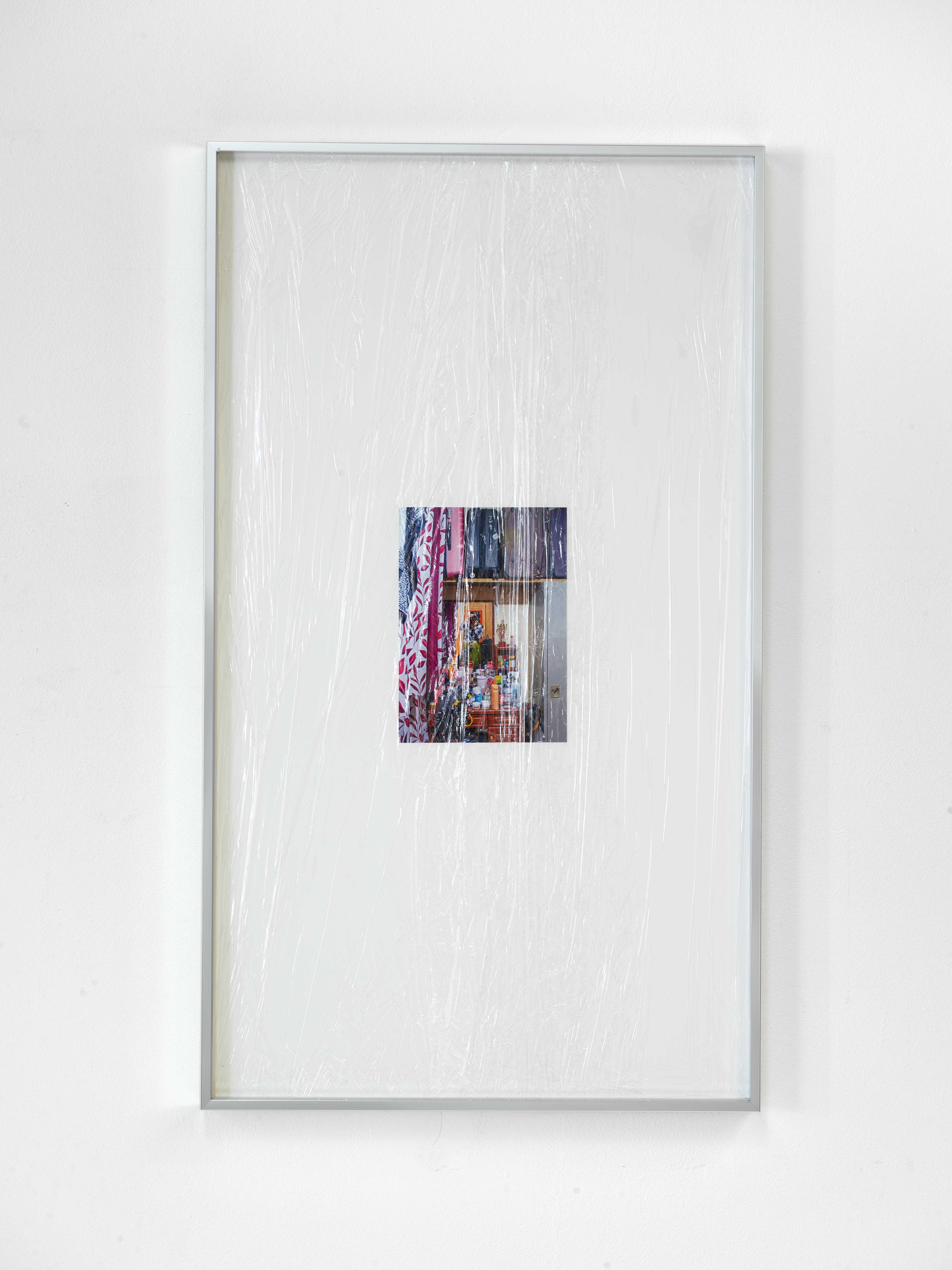 Al Satwa Balikbayan (Jasmin) 2022 digital print, cling film wrapping, archival card, aluminum frame 73,5 × 42,5 cm