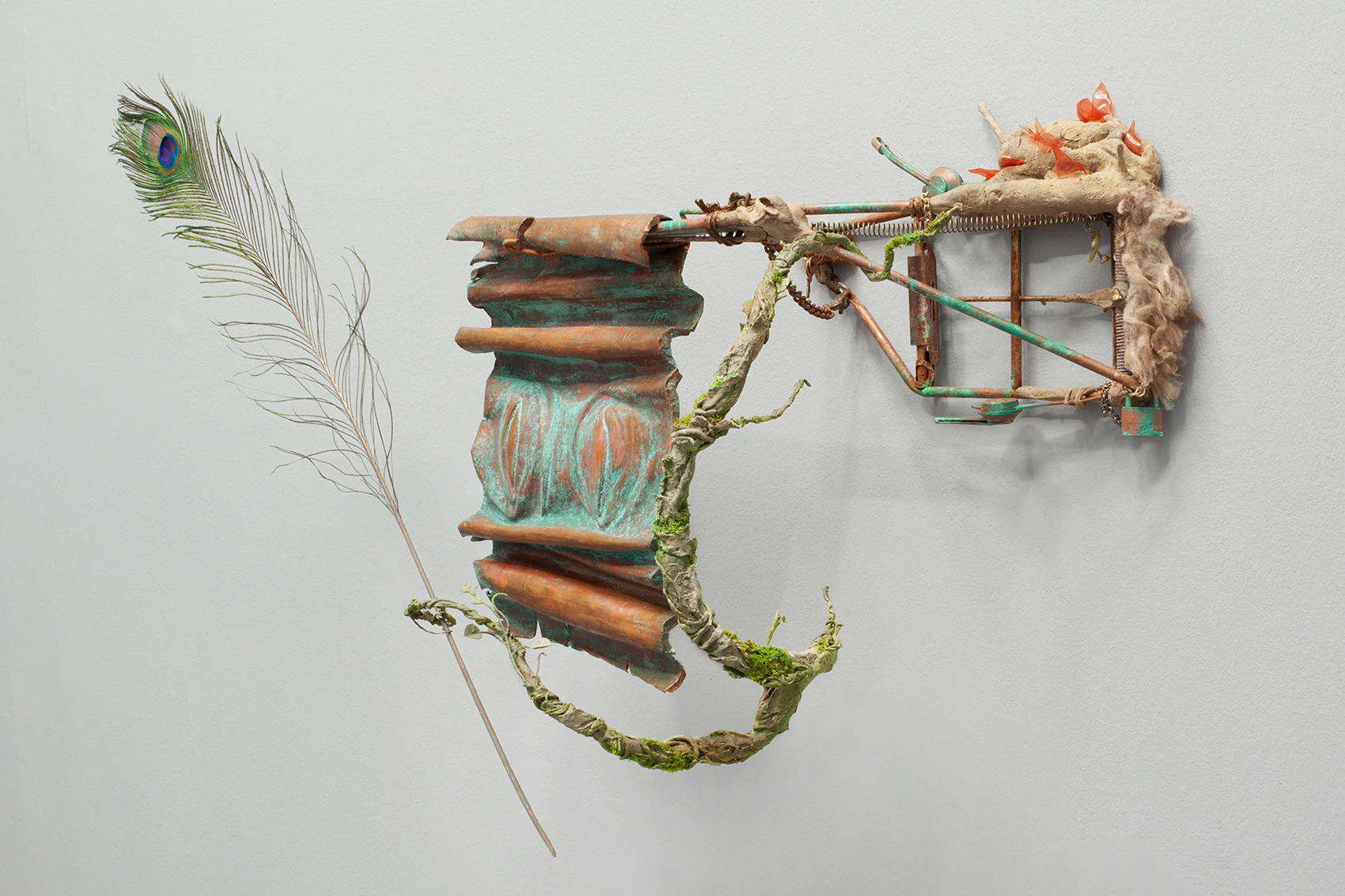 Egolatra IV, 2022, epoxy clay, concrete, acrylic paint, embossed copper, feathers, found objects, metal, wood, 60/60/20 cm