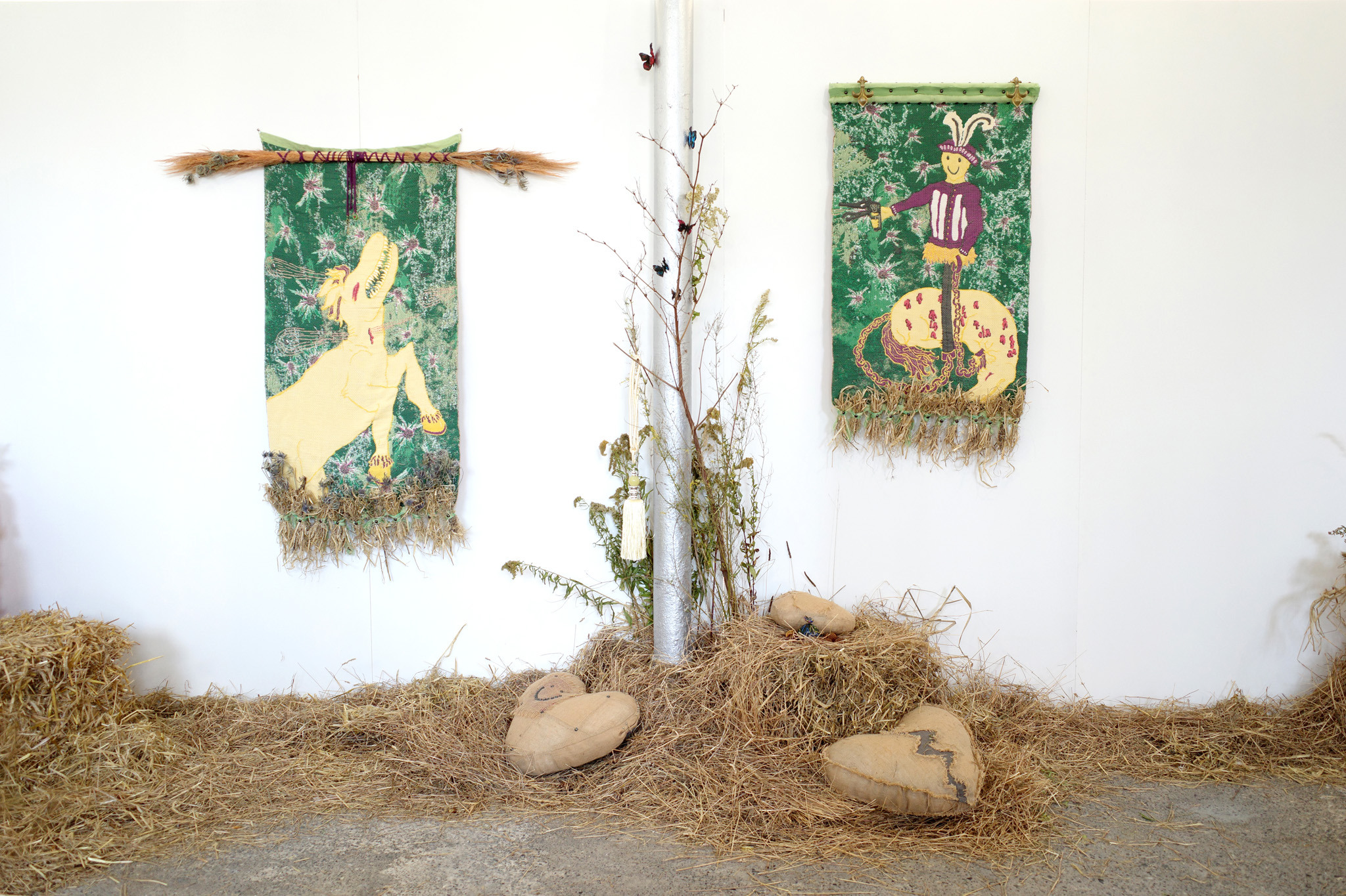 Olivia Rode Hvass, Hand Holding Memories (De dårlige minder holder i hånd), 2022. TC2-woven tapestries, upholstery, french lilies, thistles, hay. Photo: Anders Aarvik