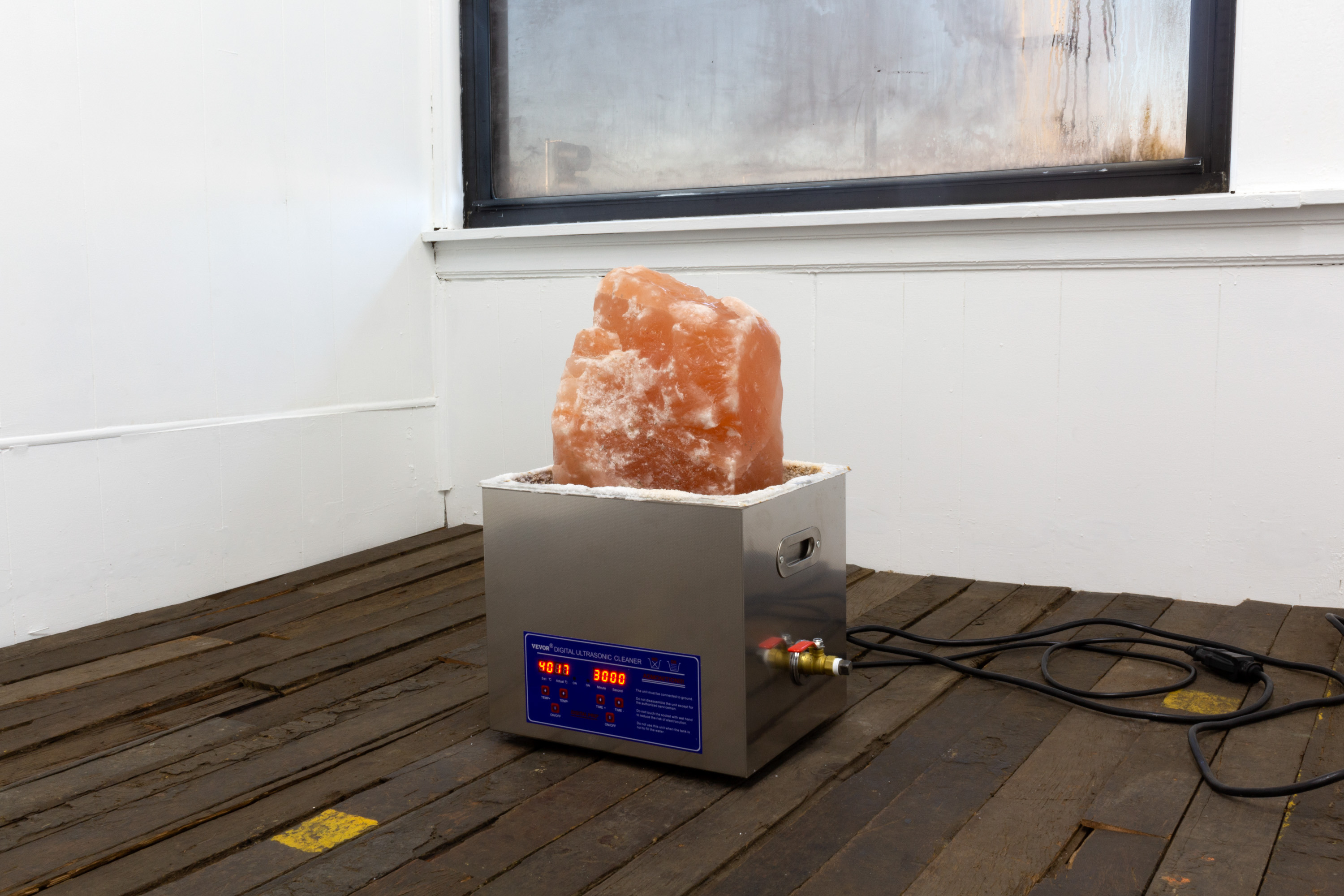 Graham Wiebe, Study for a Water Burial, 2022, Ultrasonic cleaner, water, salt rock, extension cord, 12.5 x 10.5 x 20 in