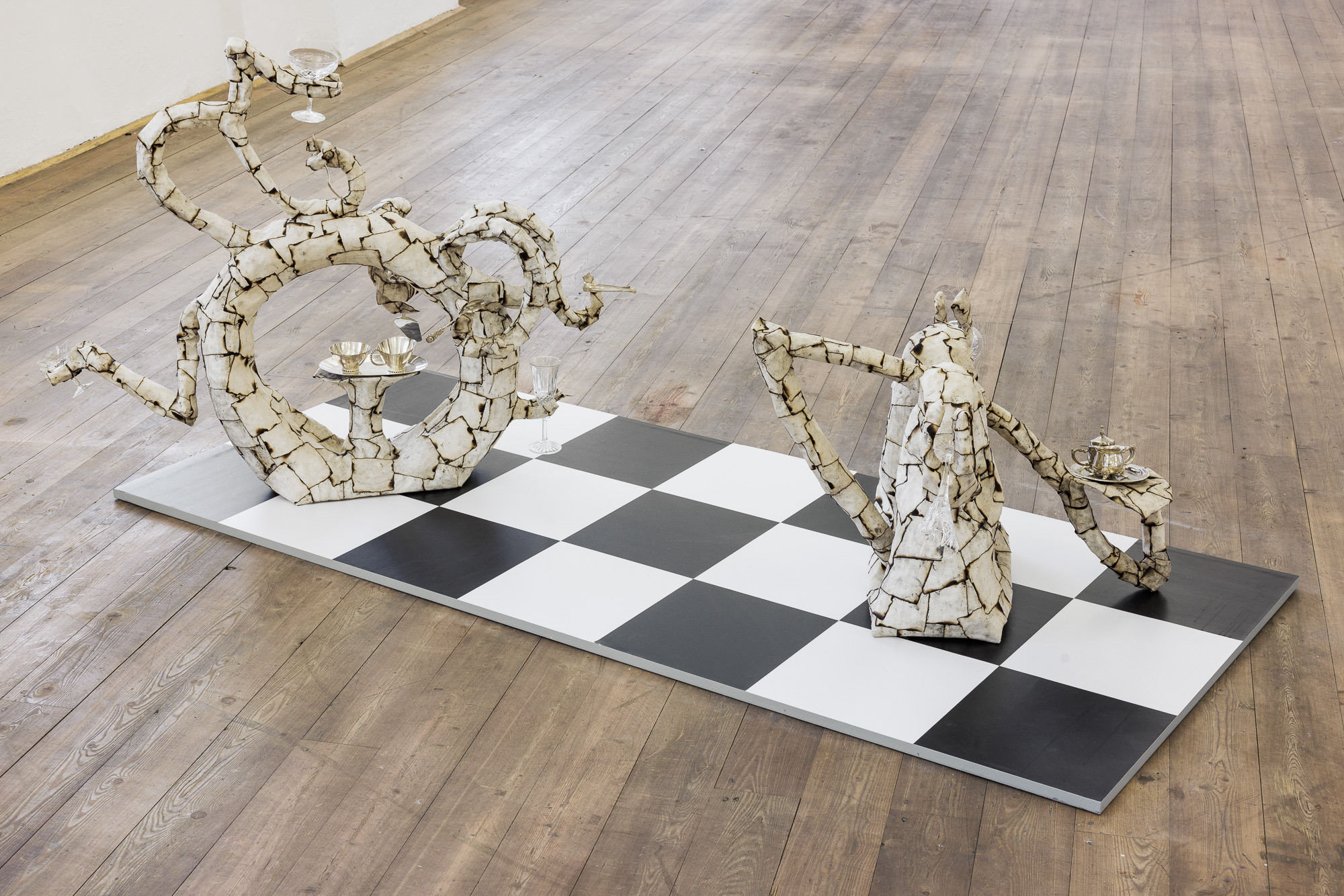 Albin Bergström Bouncerâs Castle, 2021 chicken wire, papier mache, burned canvas, crystal glass and silverware, 50x90x70 cm Beers and 40 Cigarettes, 2021 chicken wire, papier mache, burned canvas, crystal glass, and silverware, 90x120x60cm