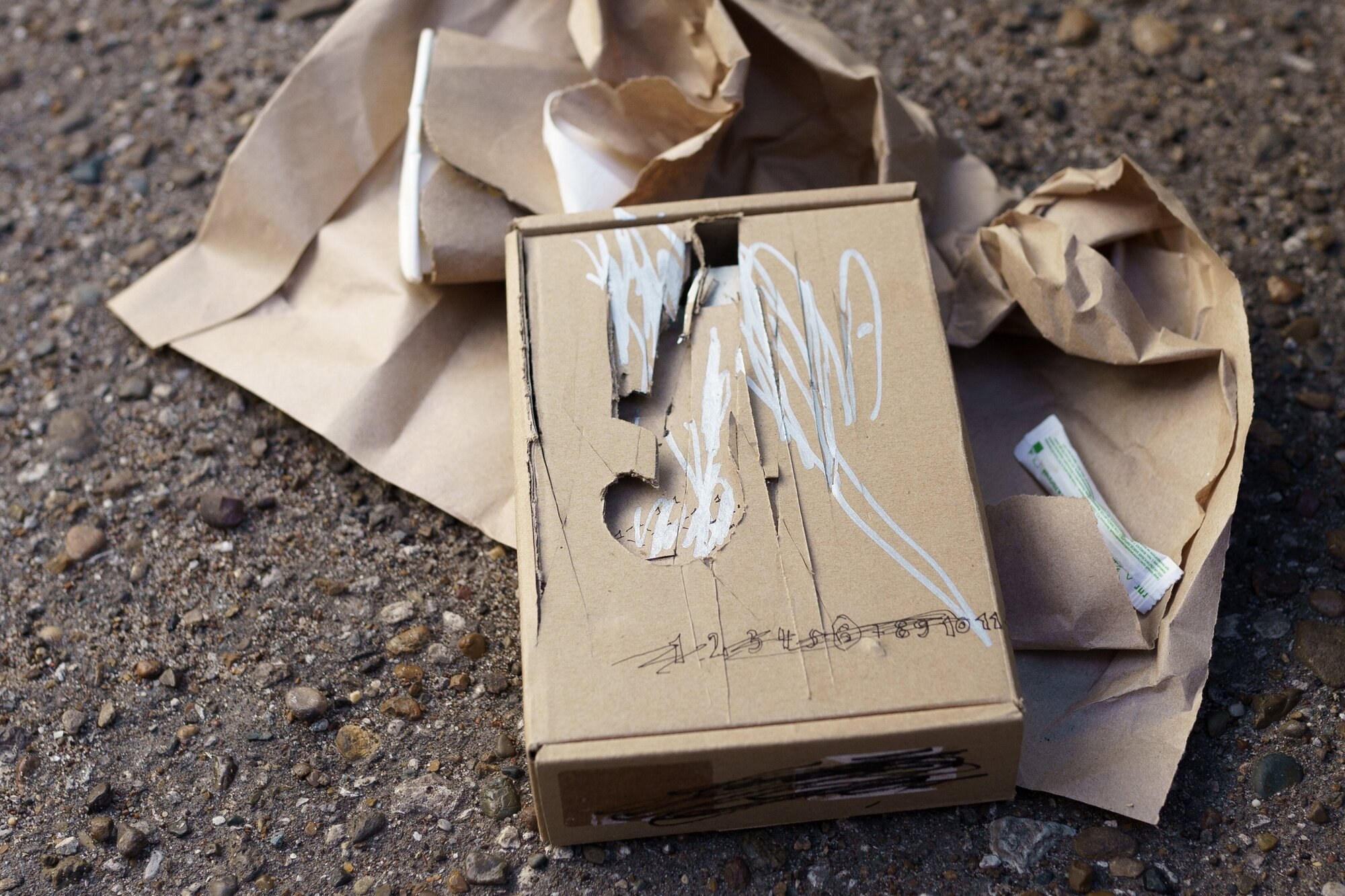 Arthur Golyakov, Unboxing, 2022, cardboard, pen, paint marker, paper cup, coffee, sugar, paper, dimensions vary