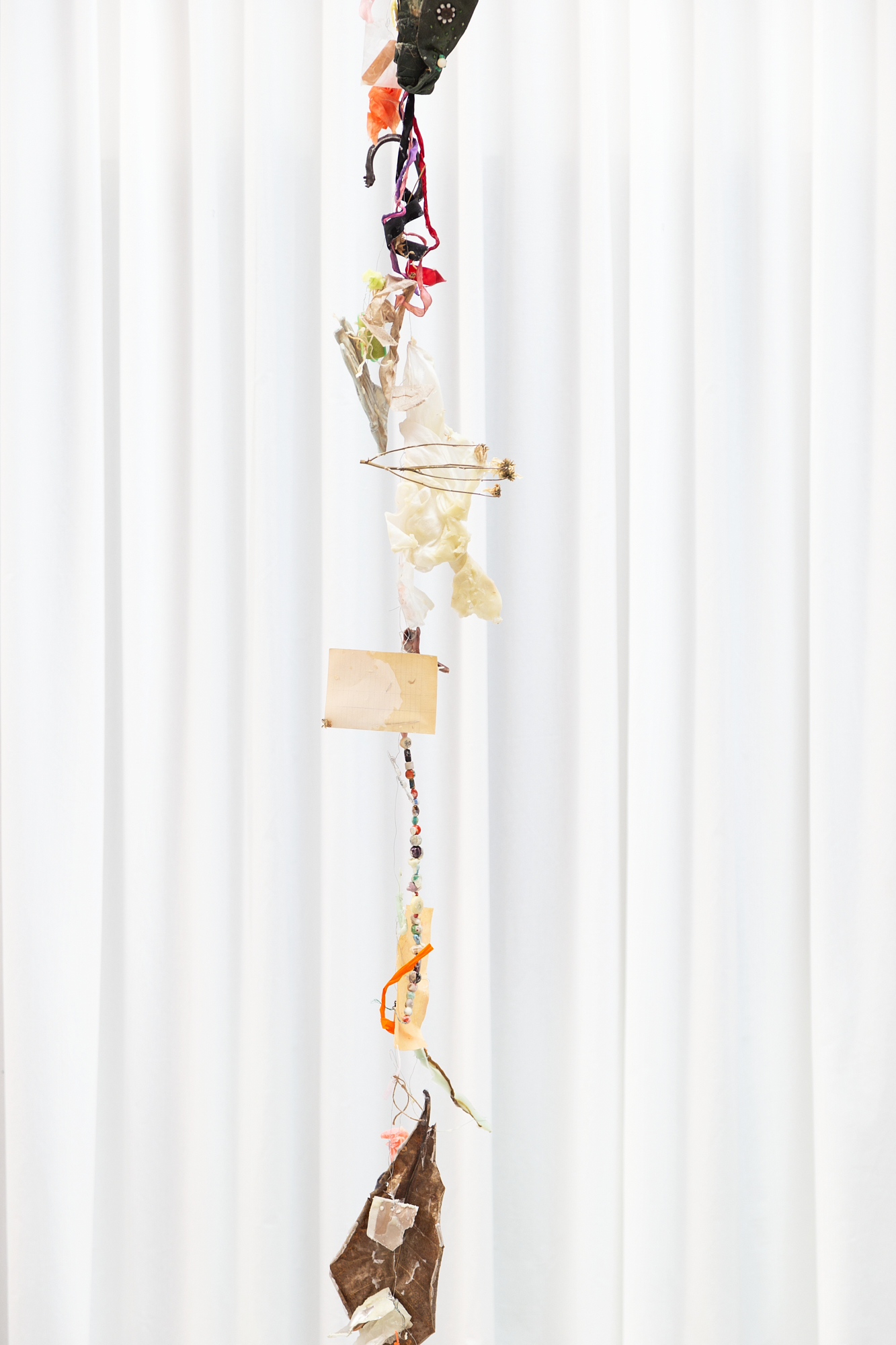 Installation View Detail, Reliquias II, Found objects, Aluminium wire, Paper and Wax, 3m high, 2022