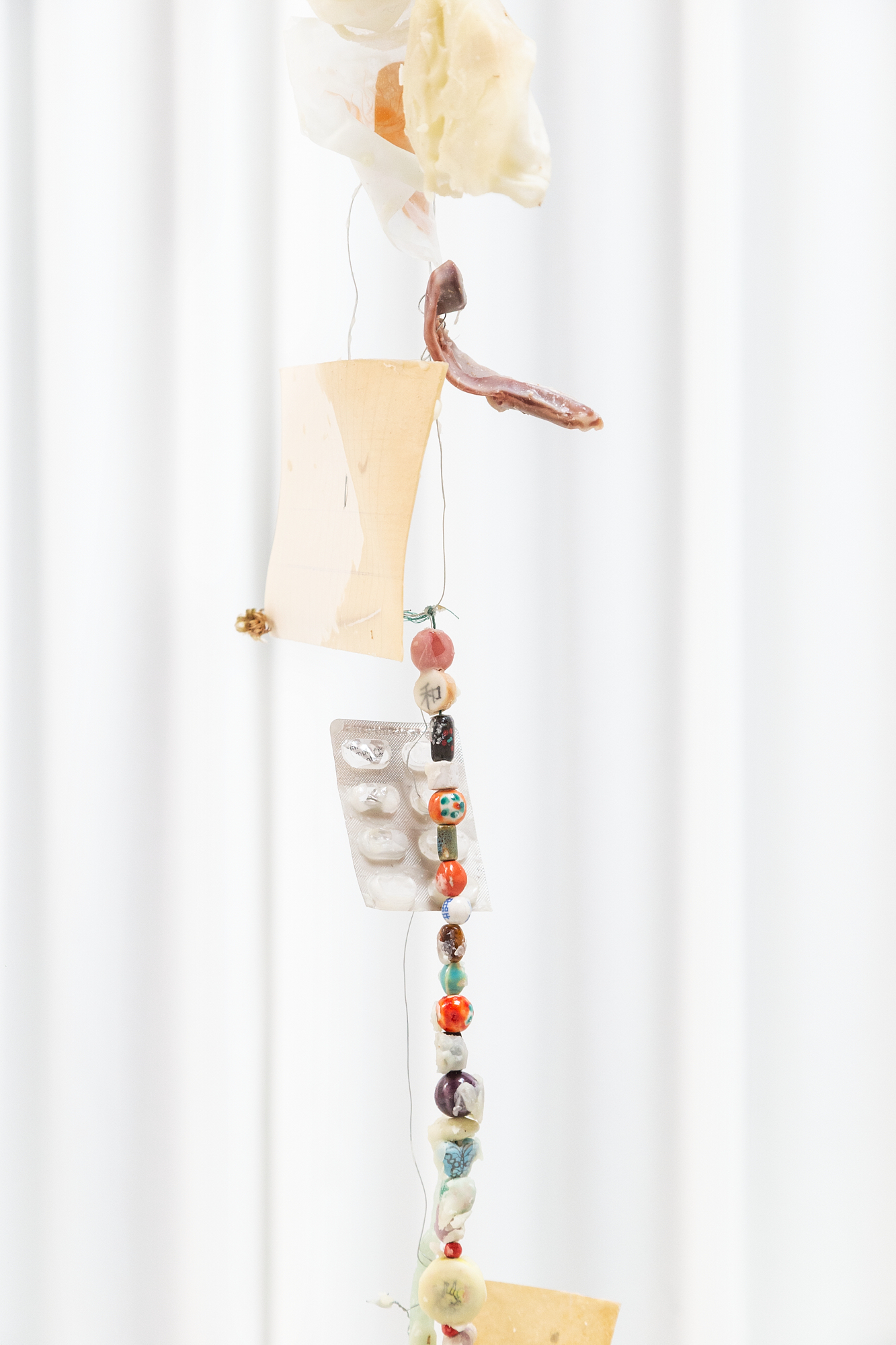 Installation View Detail, Reliquias II, Found objects, Aluminium wire, Paper and Wax, 3m high, 2022