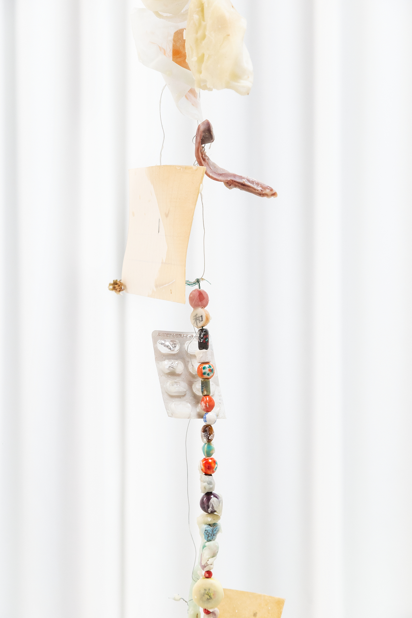 Installation View Detail, Reliquias II, Found objects, Aluminium wire, Paper and Wax, 3m high, 2022