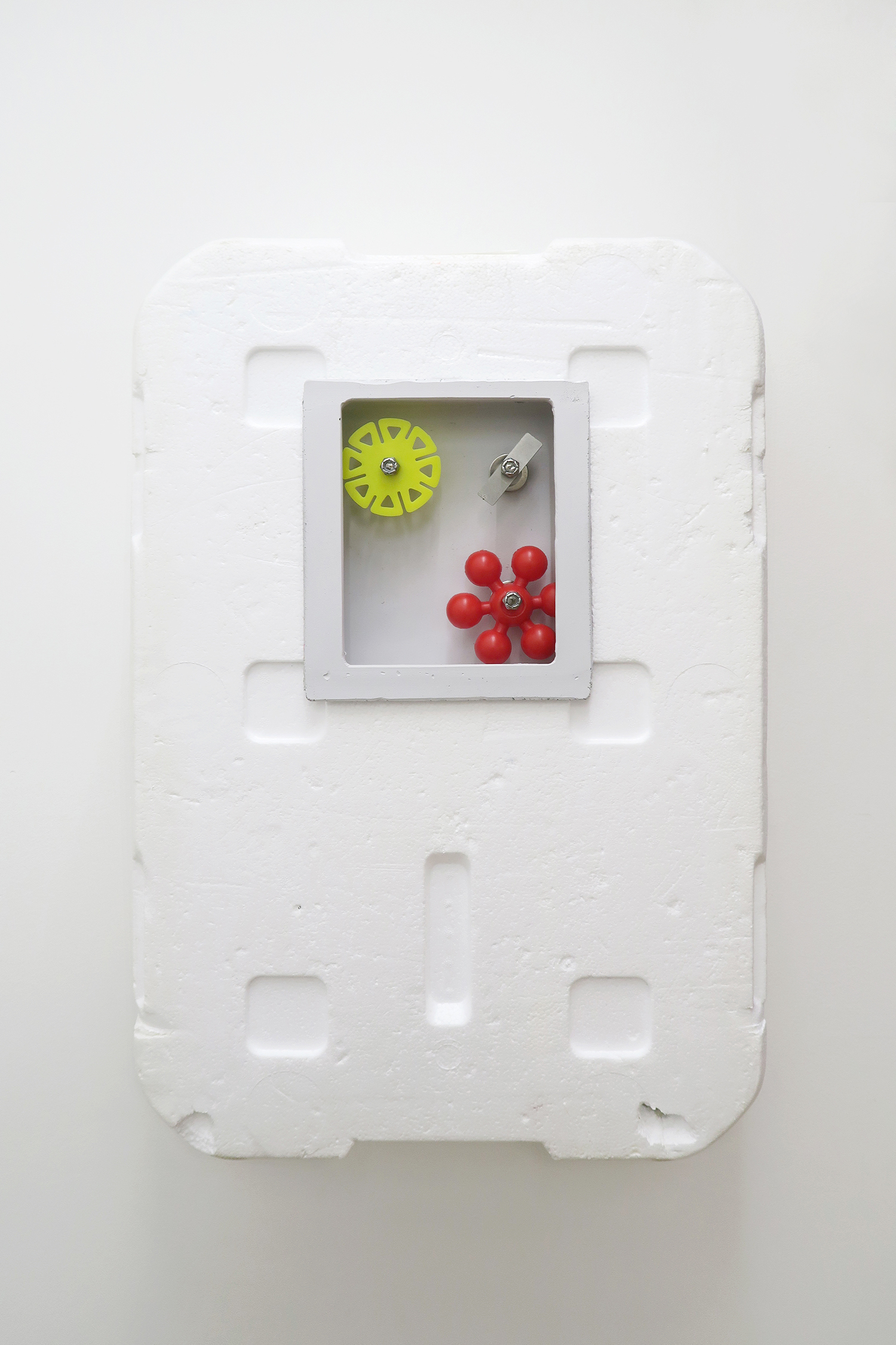 Simplify Complexity V Styrofoam box, brightly colored plastic pieces spin easily on stainless steel rods, 30 × 39.6 × 10 cm