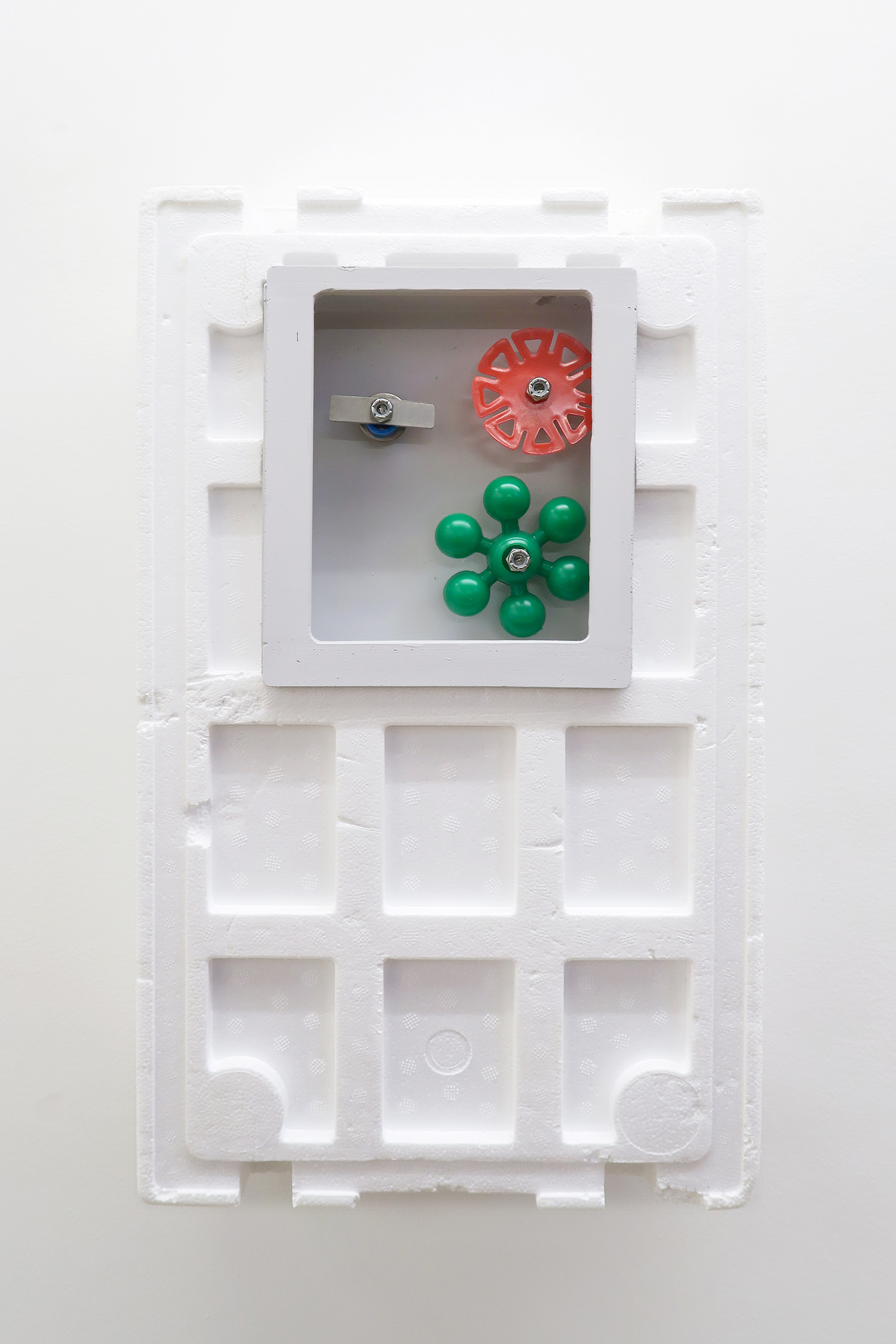 Simplify Complexity II, 2022 Styrofoam box, brightly colored plastic pieces spin easily on stainless steel rods, 30 × 49.8 × 14 cm
