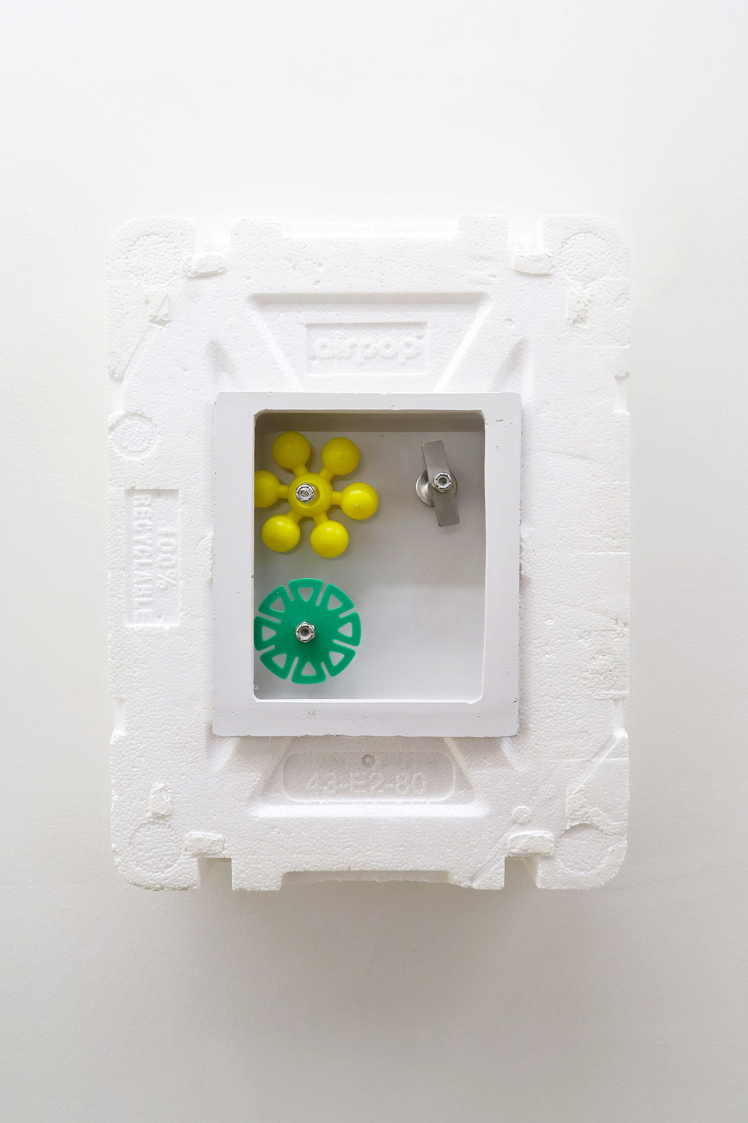Simplify Complexity III, 2022 Styrofoam box, brightly colored plastic pieces spin easily on stainless steel rods,  26.5 × 40 × 13.5 cm