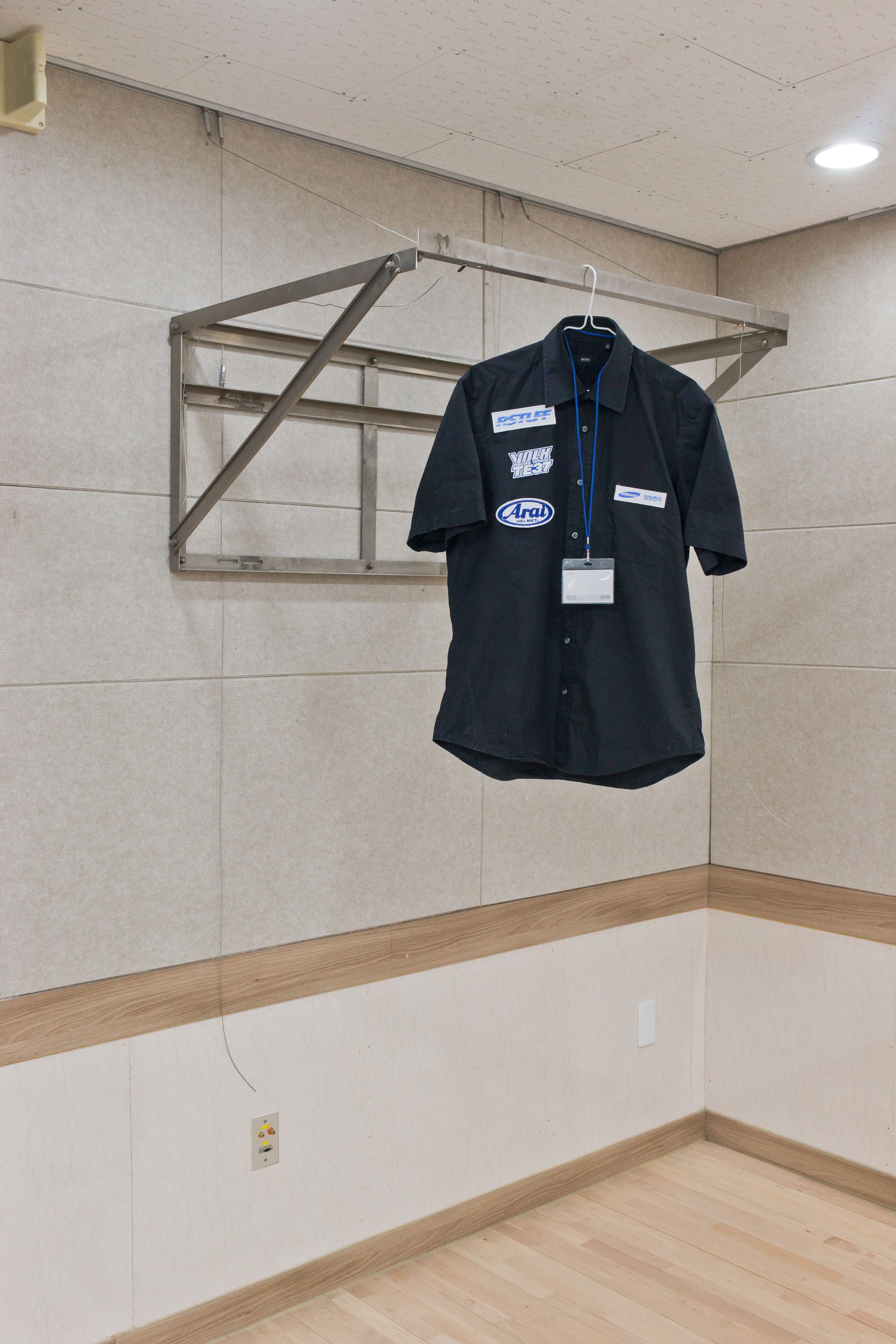 Untitled (too busy to work), Christian Eisenberg, 2022, Short Sleeve Shirt, Nylon Embroidery, Aluminium, 100 x 70 x 90 cm
