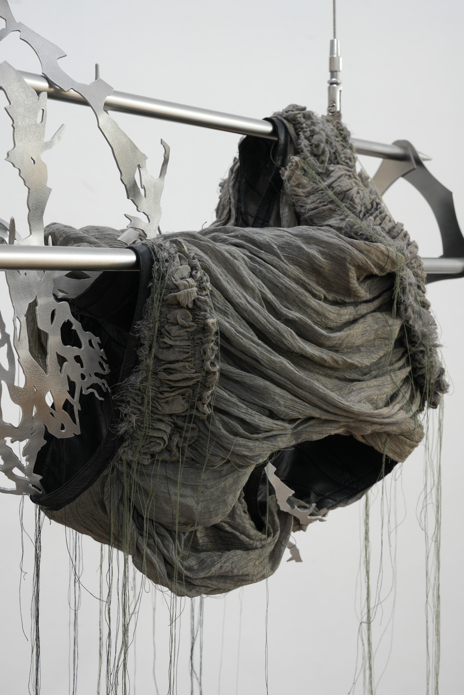 Premonition I, stainless steel, aluminum, linen, recycled leather, 2022