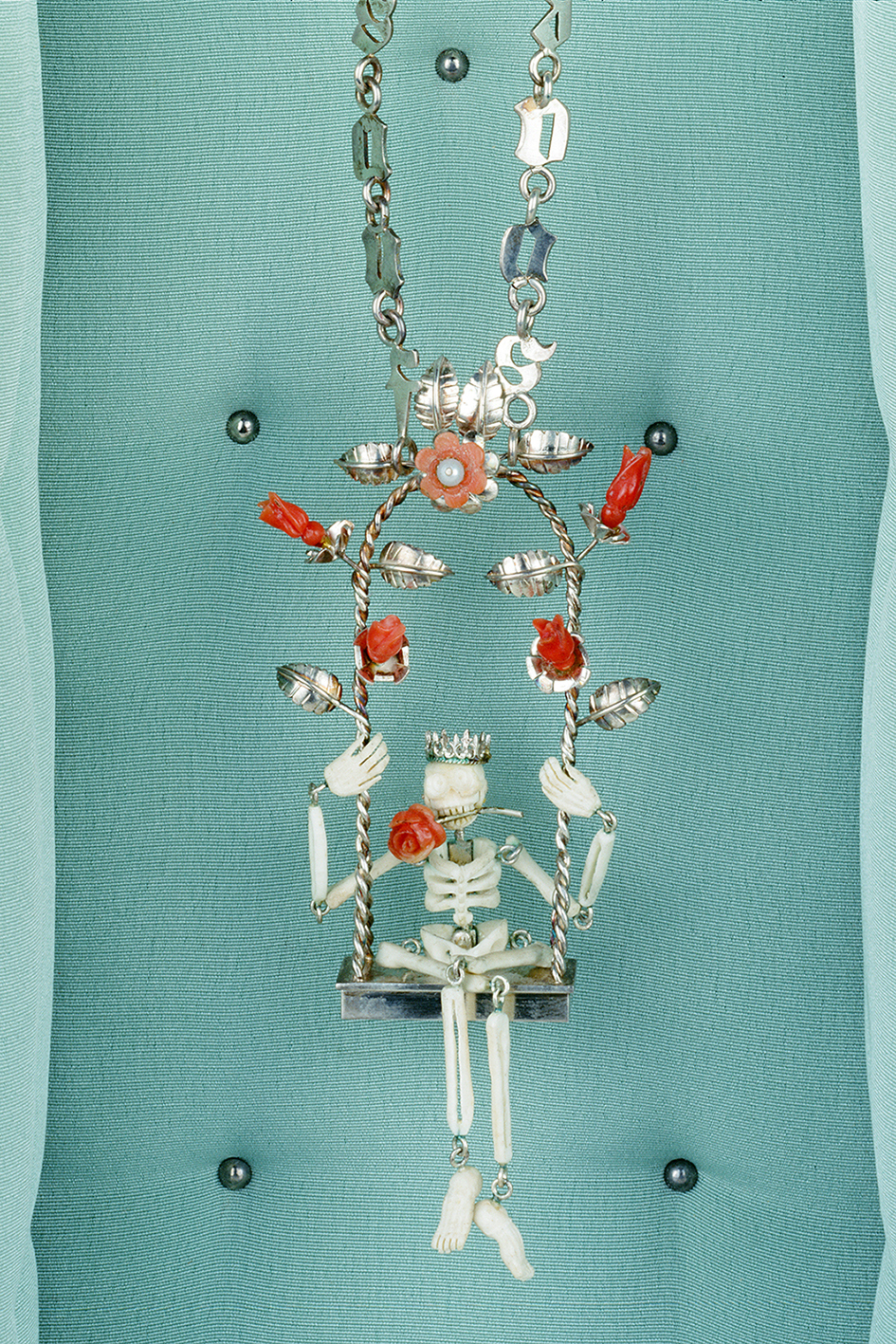 20/21 Ulrike Johannsen, Reisereliquiar (Tod auf der Schaukel), 1995. Silver, coral, bone, Pedals, silk in custom box and pedestal, 65x30x30 cm