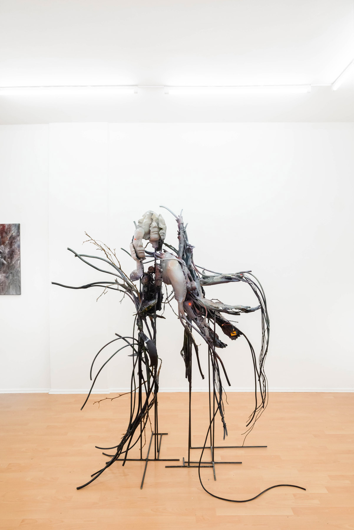 Yein Lee. devouring chaos - growth of reconstructed time, overflowing bodies, and static electricity, 2022, brocken chain saw, drill motor, mixer motor, fake flower, dry branches, electrical wire, polymer gypsum, epoxy putty, steal, acrylic color, lacquer