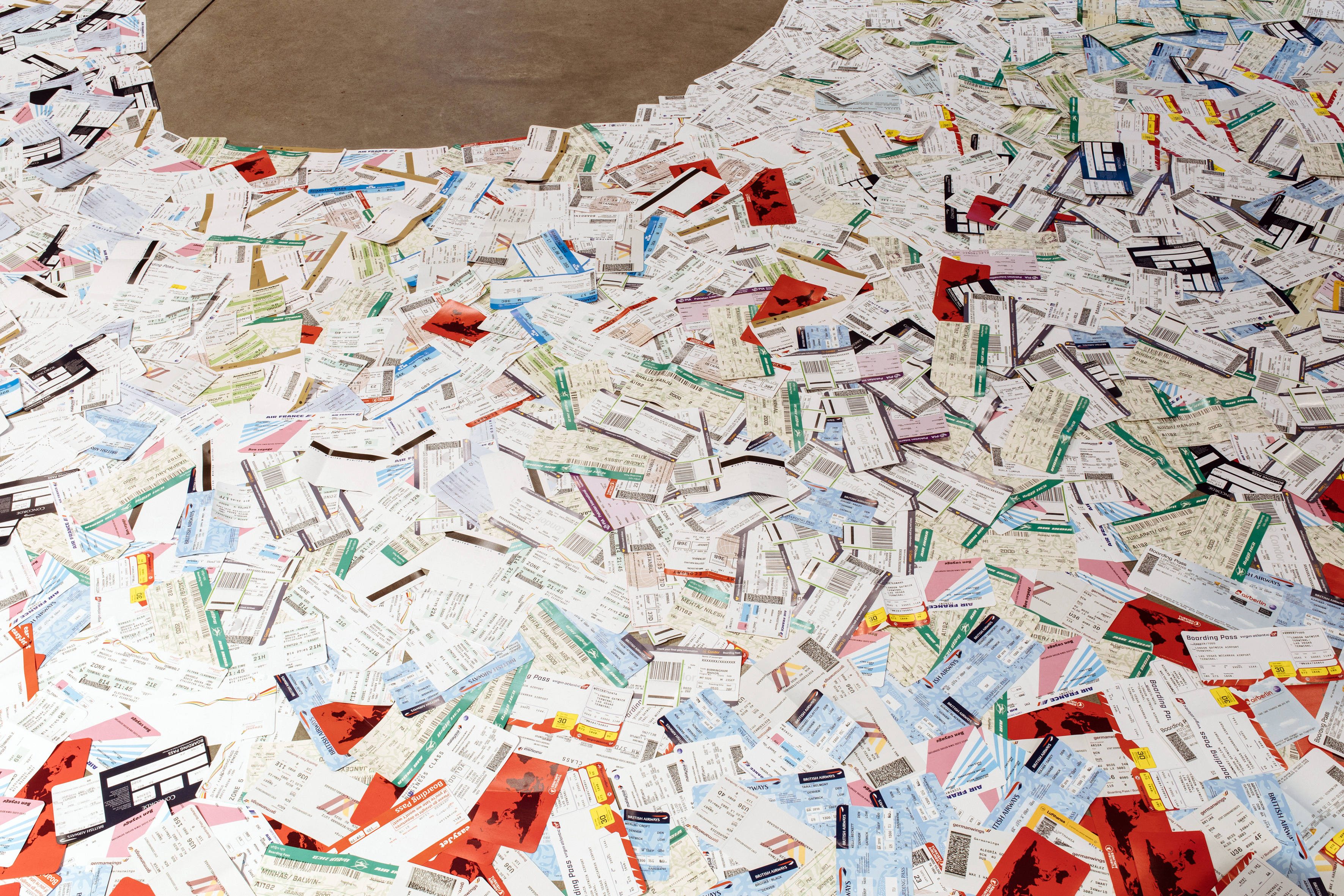 empty seats - 2022 - material: about 5000 replicated airplane tickets of different airlines, patafix glue pads, 1100 × 1 × 547 cm