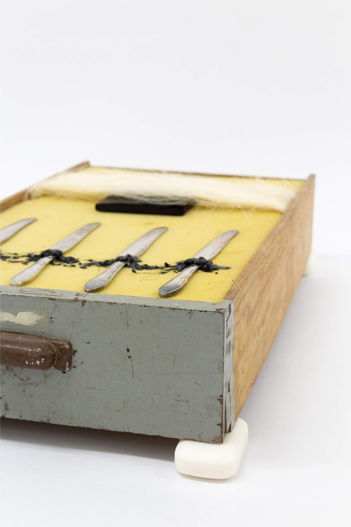 Melanie Wiksell, Spun Time, 2020, Soap, drawer, foam rubber, book, ink, vegetable fibers, silver plated knives, sealing wax, 23.6 x 13.8 x 5.5 in