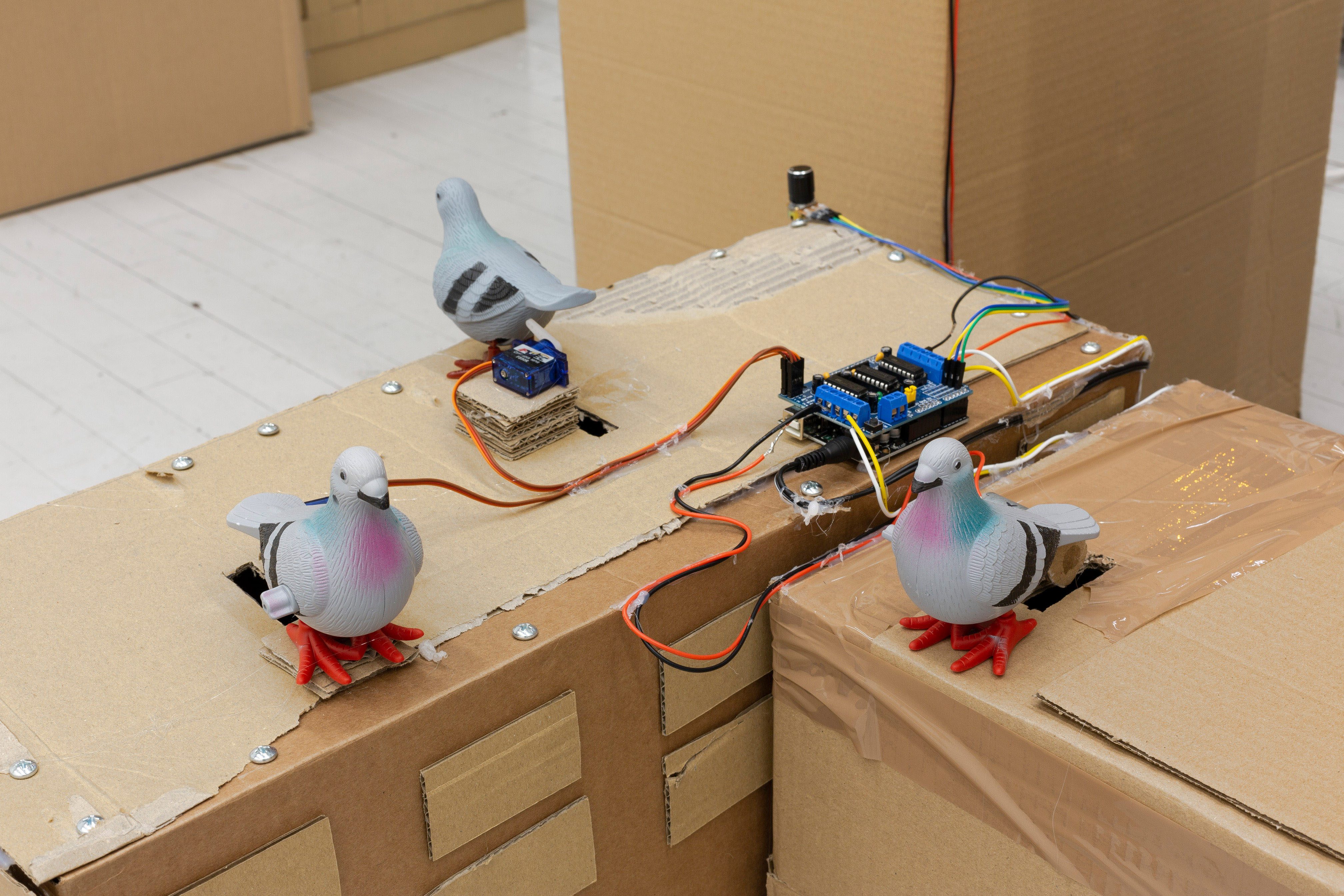  Pigeon-Core Plastic birds, Arduino Microcontroller, Motors, Electronics, Hardware, Cardboard (detail)