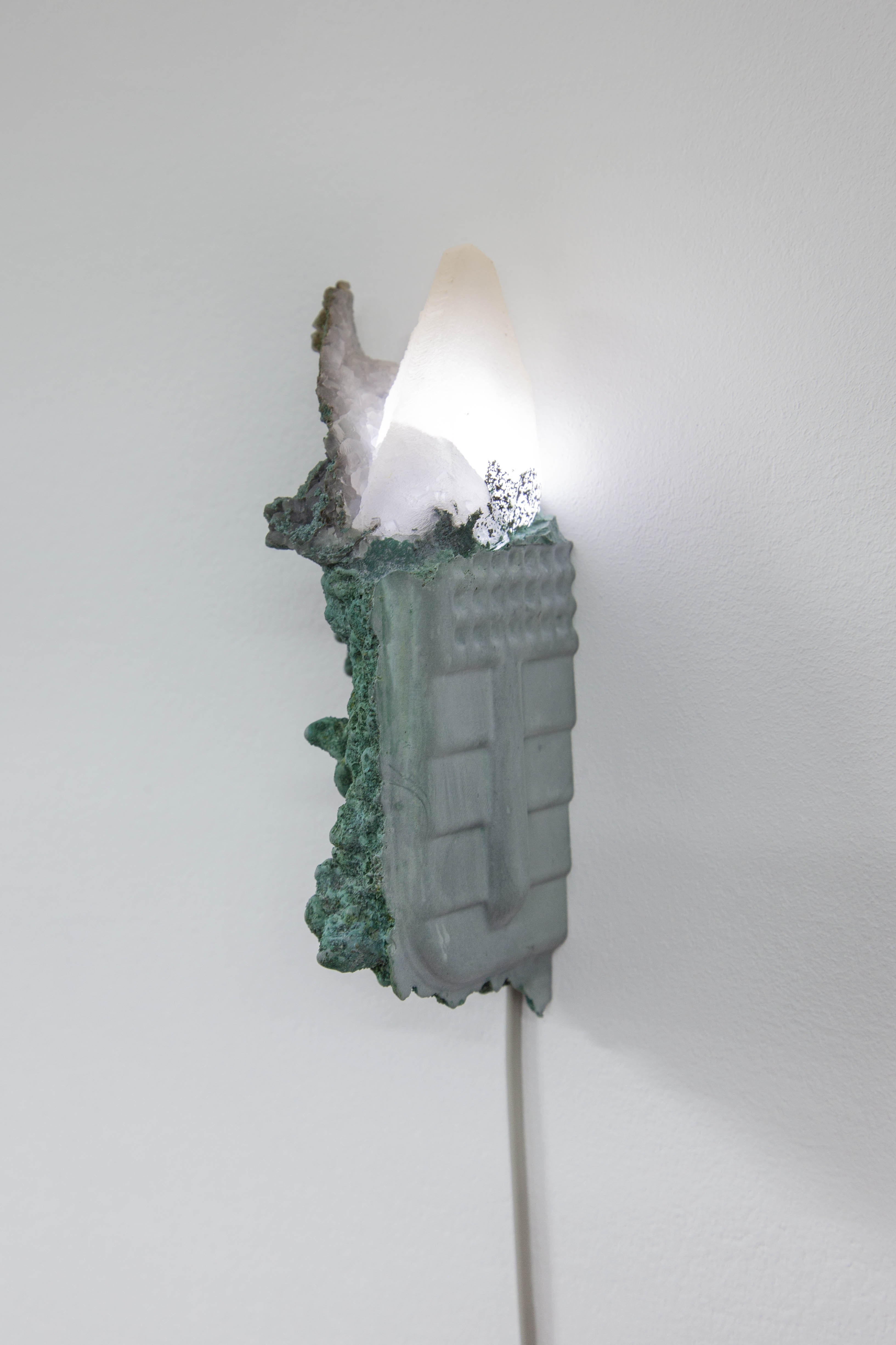 Initiation, 2023 Calcite, gypsum plaster, magnetite sand, flickering LED, epoxy clay, pigments