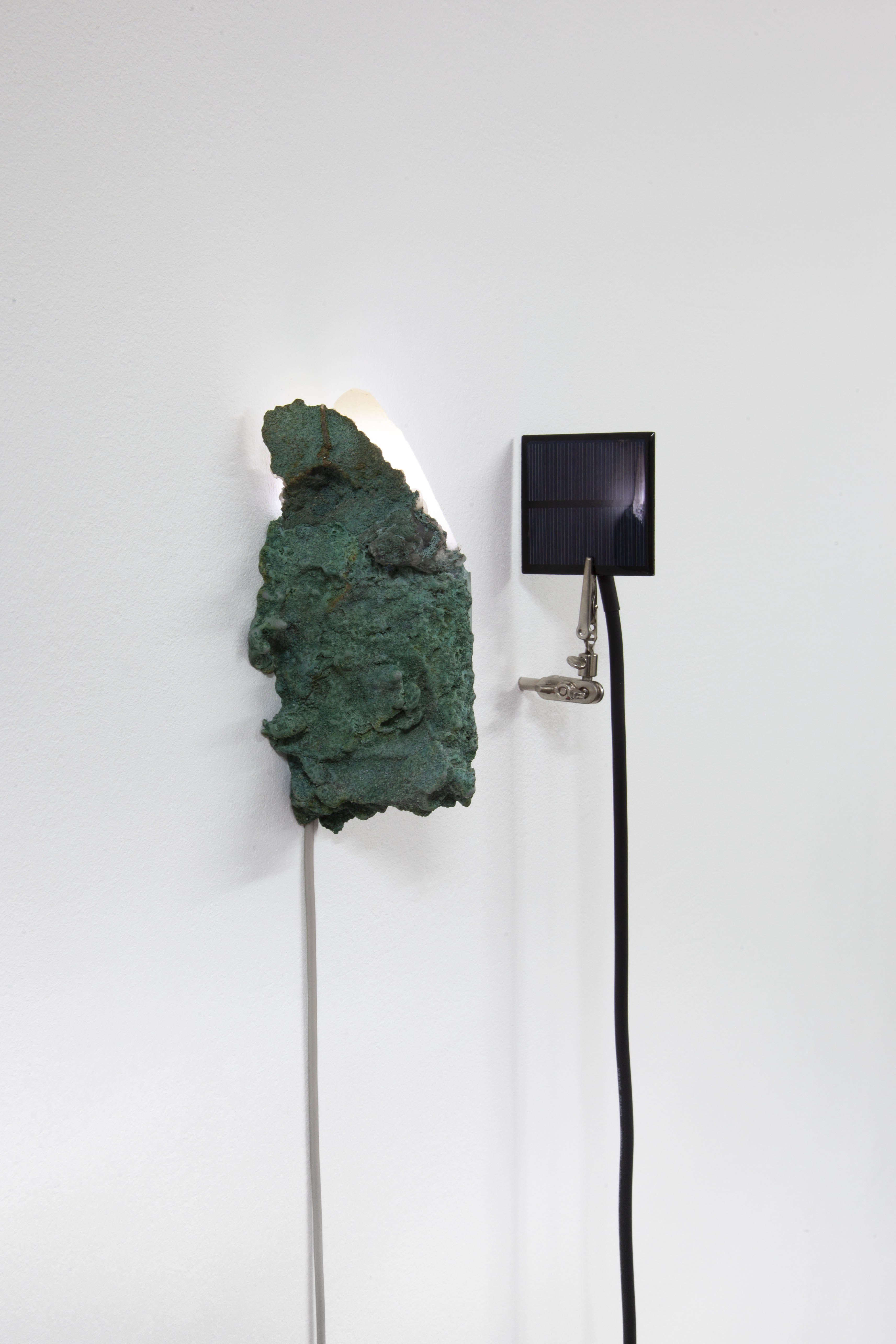 Initiation, 2023 Calcite, gypsum plaster, magnetite sand, flickering LED, epoxy clay, pigments