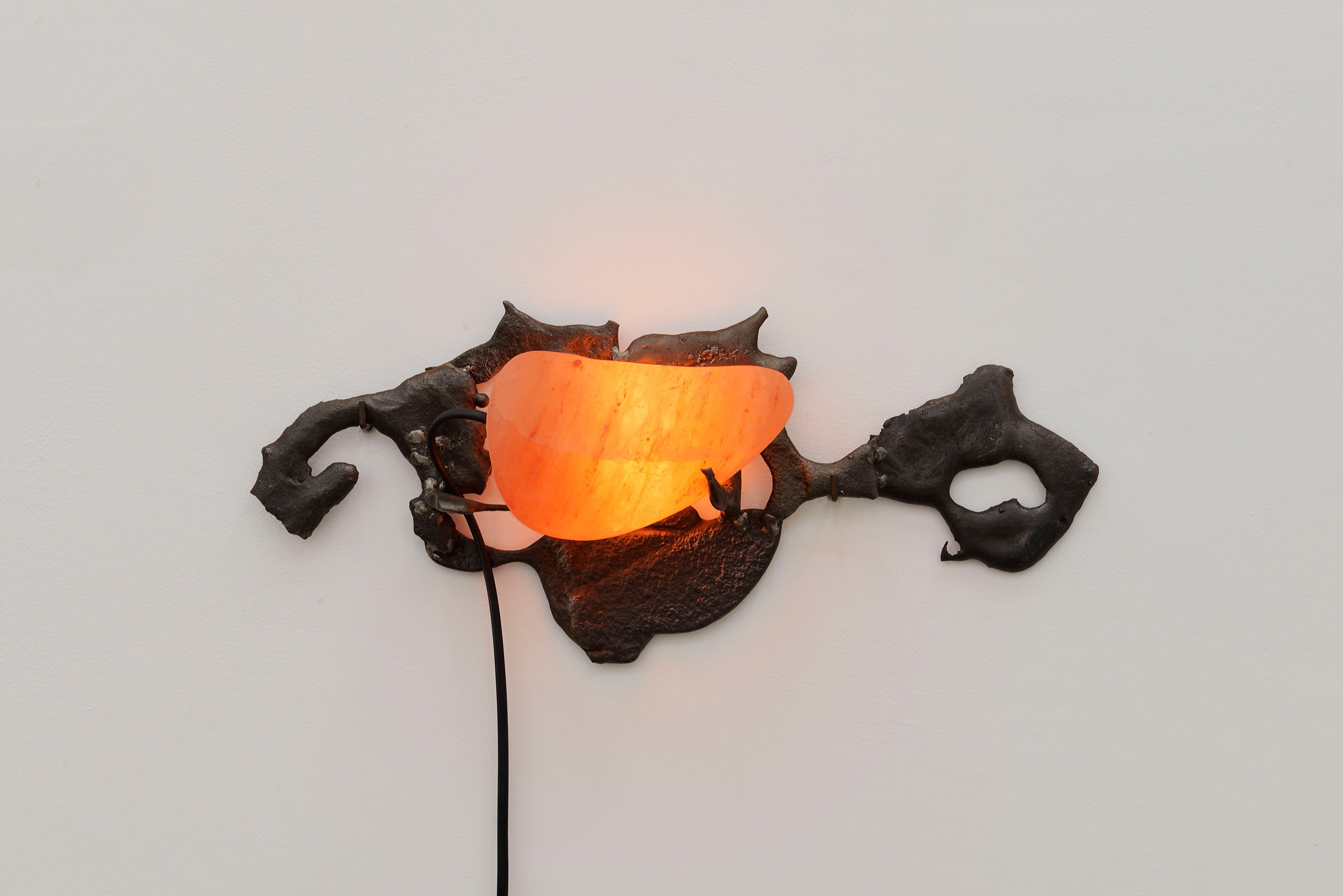 Jacopo Belloni, Paranoid Lamp #4, 2023, spheroidal cast iron, crystals of salt, halogen light bulbs, cables, 40 x 8 x 20 cm