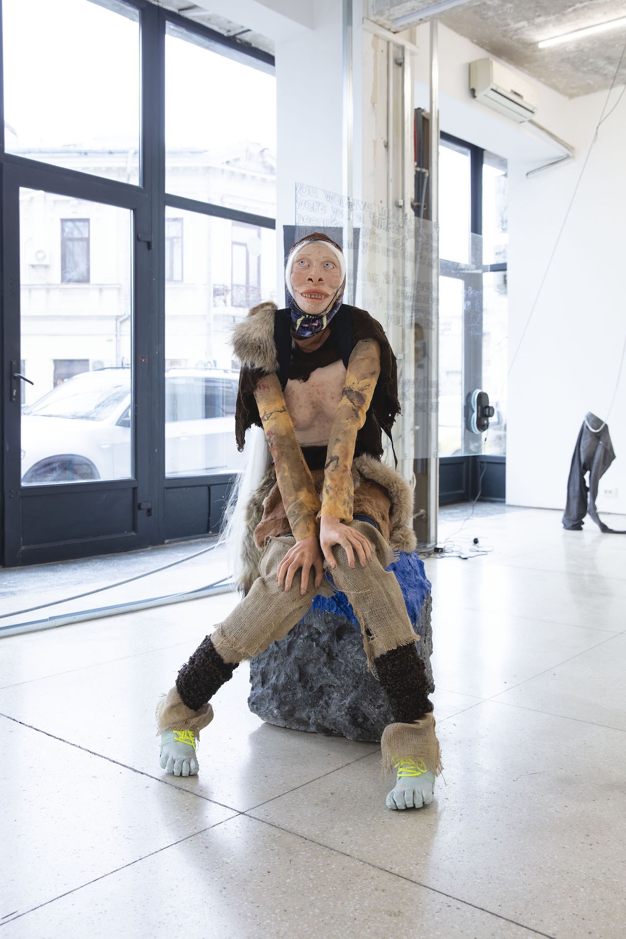 Klara Zetterholm, Fivefingers, 2020, plexiglass mannequin, synthetic clay, wig, fur, baby doll, textiles, vibram shoes, styrofoam, acrylics
