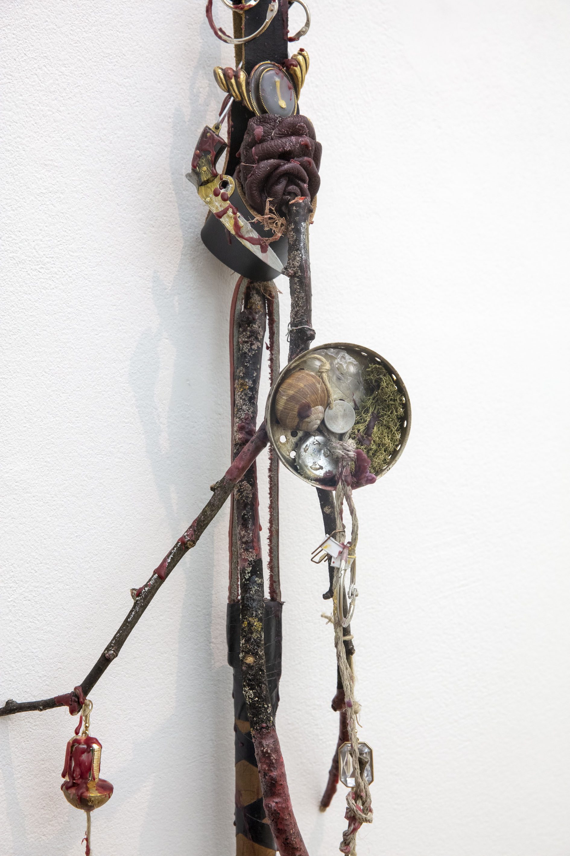 Anna McCarthy, Keychain, 2023, mixed media, wood, wax, jewellery, snail shell, moss, plastic hairclip, sink sieve, keyrings, present from suse, silver spoon, leather, gold & silver pigment, 260 × 25 × 10 cm