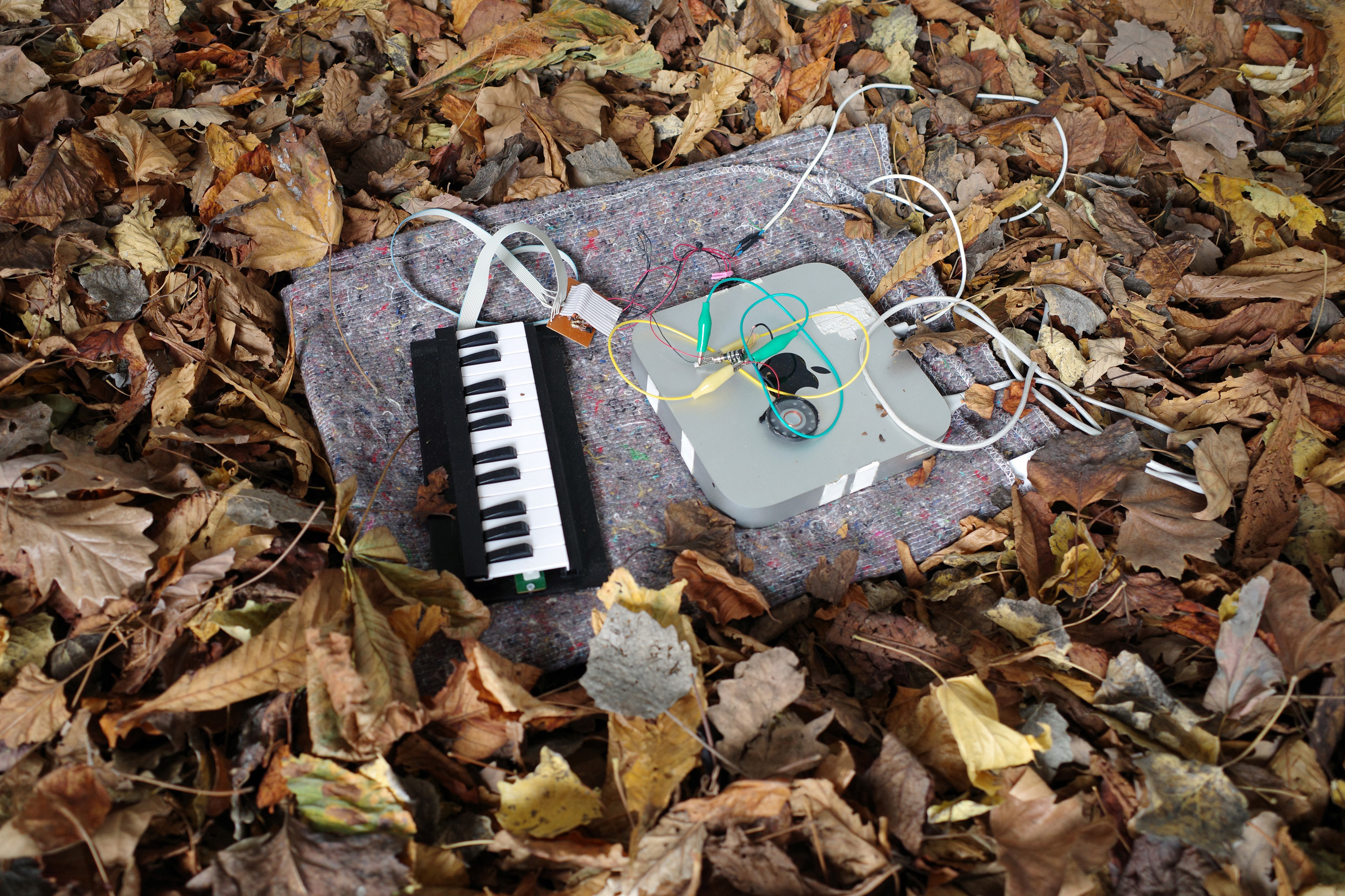 devboard (composition for modded keyboard), 2023, Halfdan Kajhøj. Moving blanket, keyboard, various 3d printed parts, cables and Mac mini