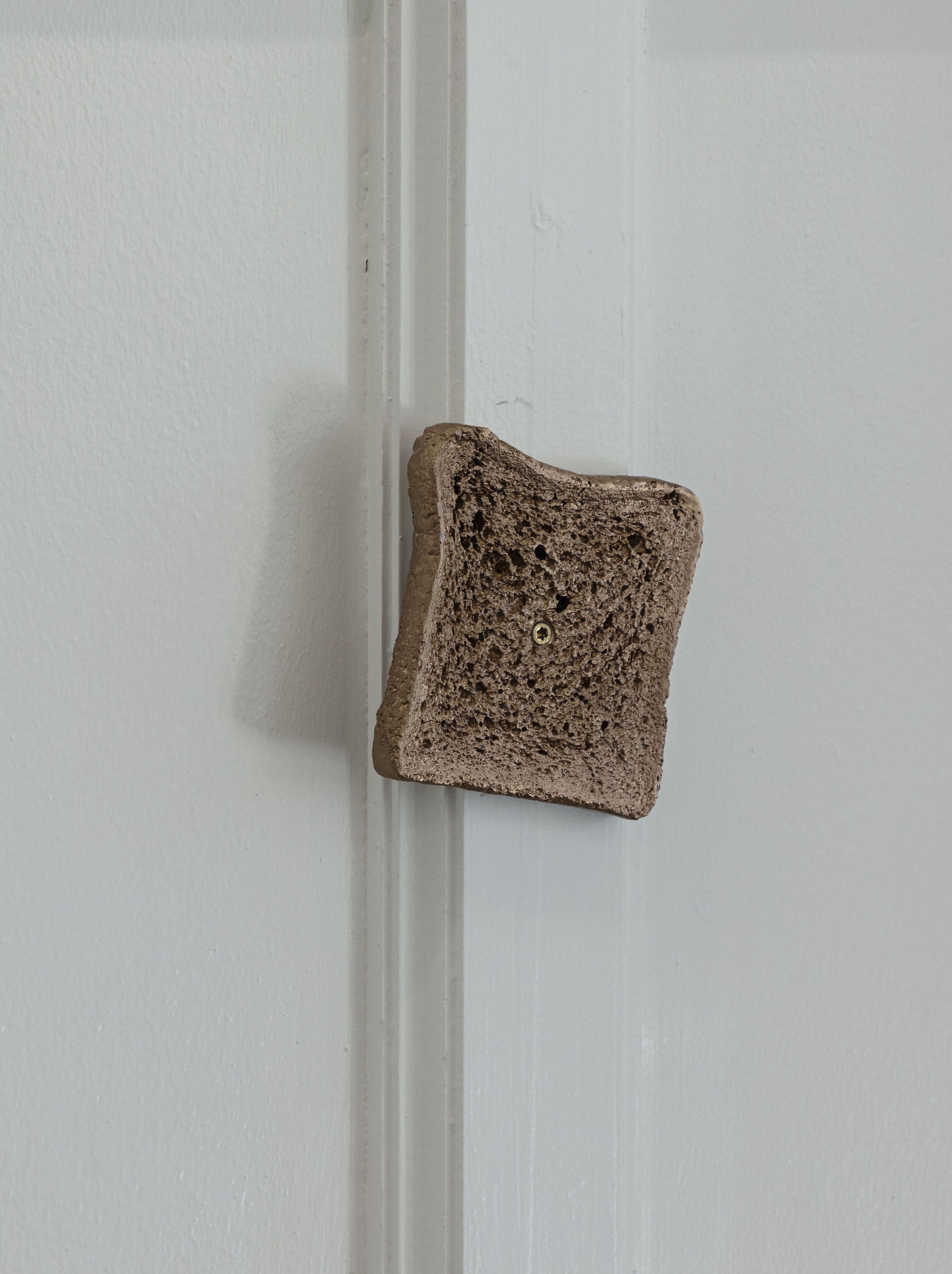 Benedikte Bjerre: Starry Night, 2023. Installation view OâOvergaden. Direct bronze cast of bread 32 parts. Each approx. 1 x 10 x 13 cm. Installation size variable. Photo: Laura Stamer