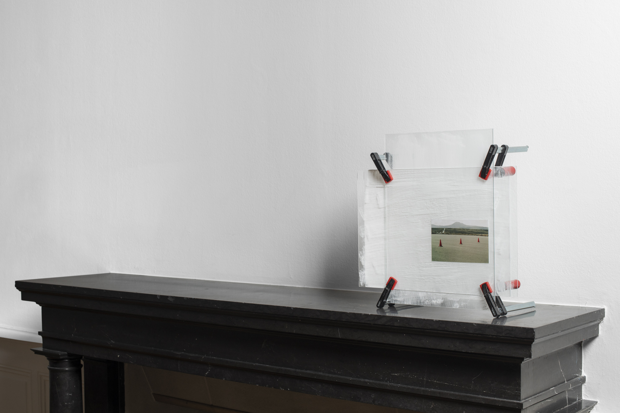 Yvan Alvarez, Frame (makeshift devices), inkjet print, glass, clamps, 43 x 44 x 21 cm, 2023 