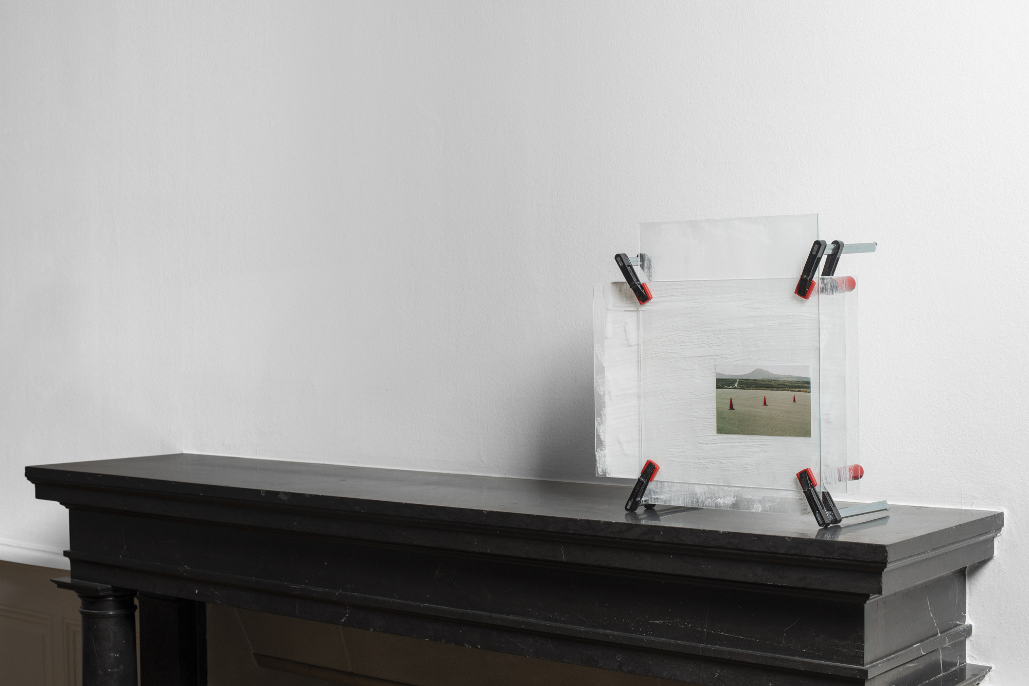 Yvan Alvarez, Frame (makeshift devices), inkjet print, glass, clamps, 43 x 44 x 21 cm, 2023
