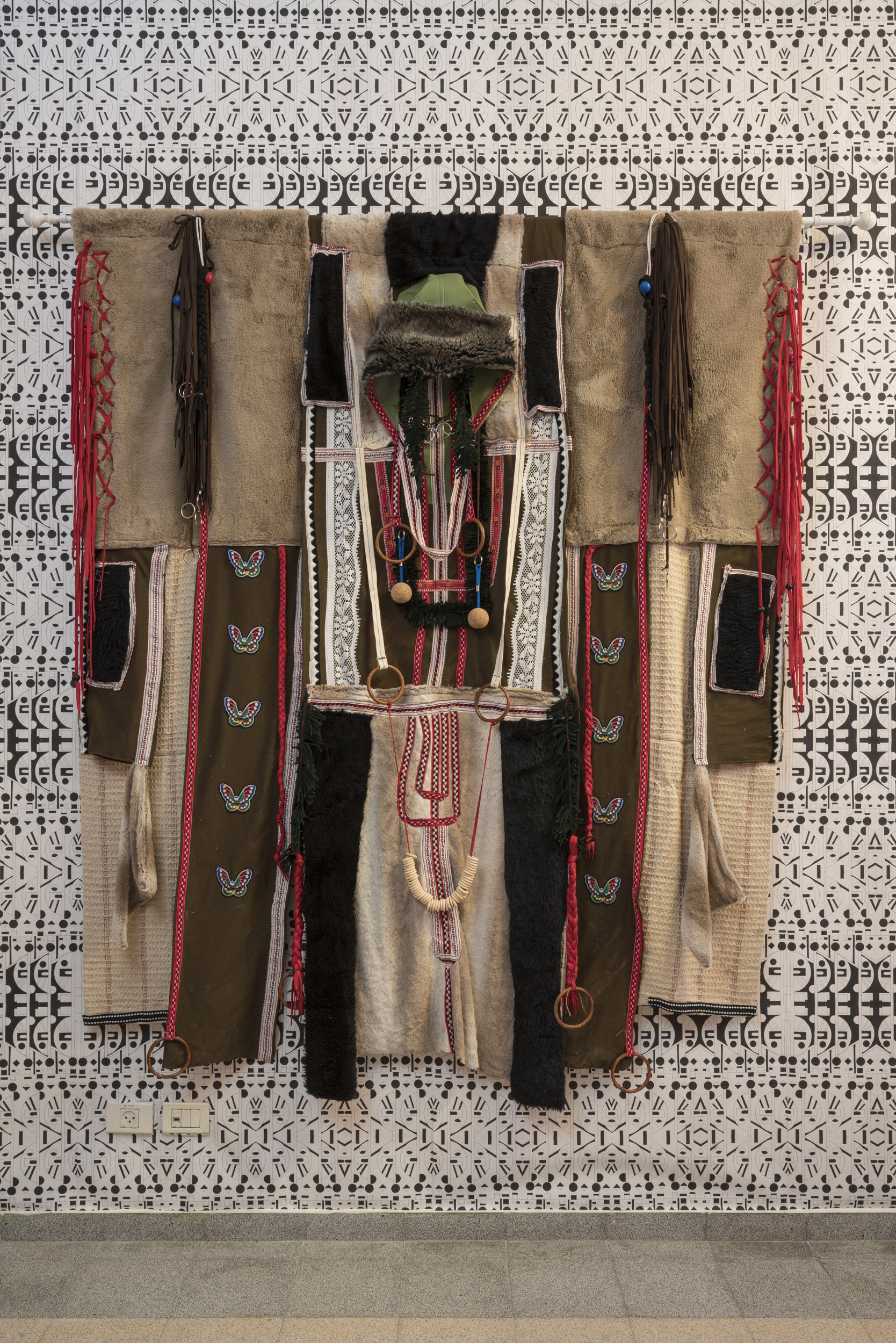 Amour for a Sensitive Heart, 2022, fabric, wool, shoelaces, wooden hooks, mops, synthetic fur, 220X90 cm