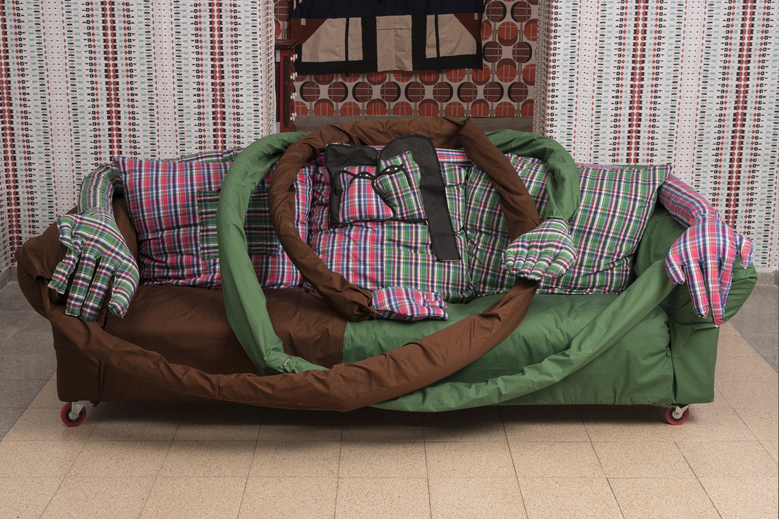 Kissing Sofa, 2022, Sofa, fabric, pillows, shoelaces, wheels, 70X200X90 cm
