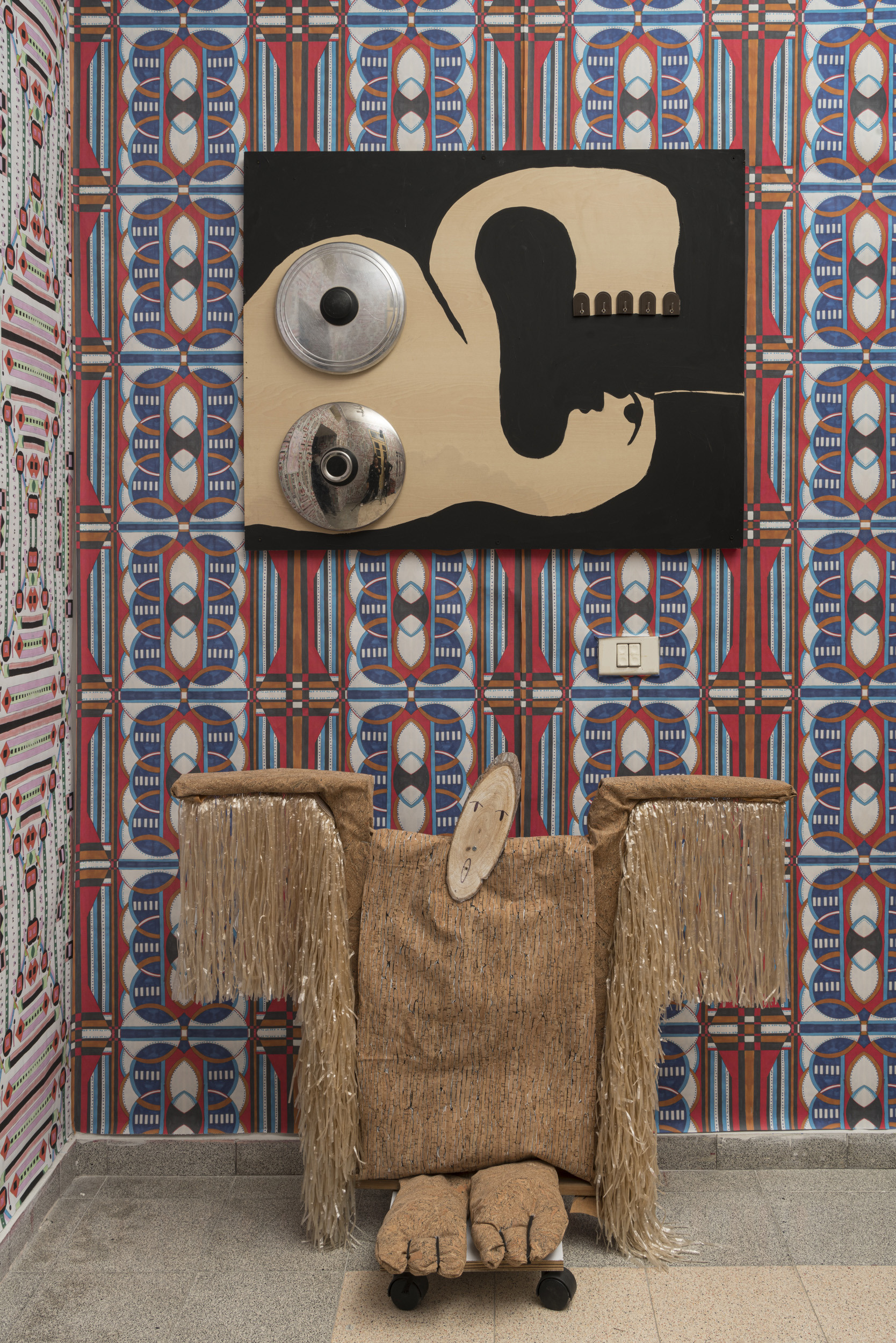 Pots Lady, 2022, Acrylic, plastic hangers, pot covers, wood + Tree Spirit, 2022, Wood, wheels, synthetic raffia, cork fabric, 70X100 cm