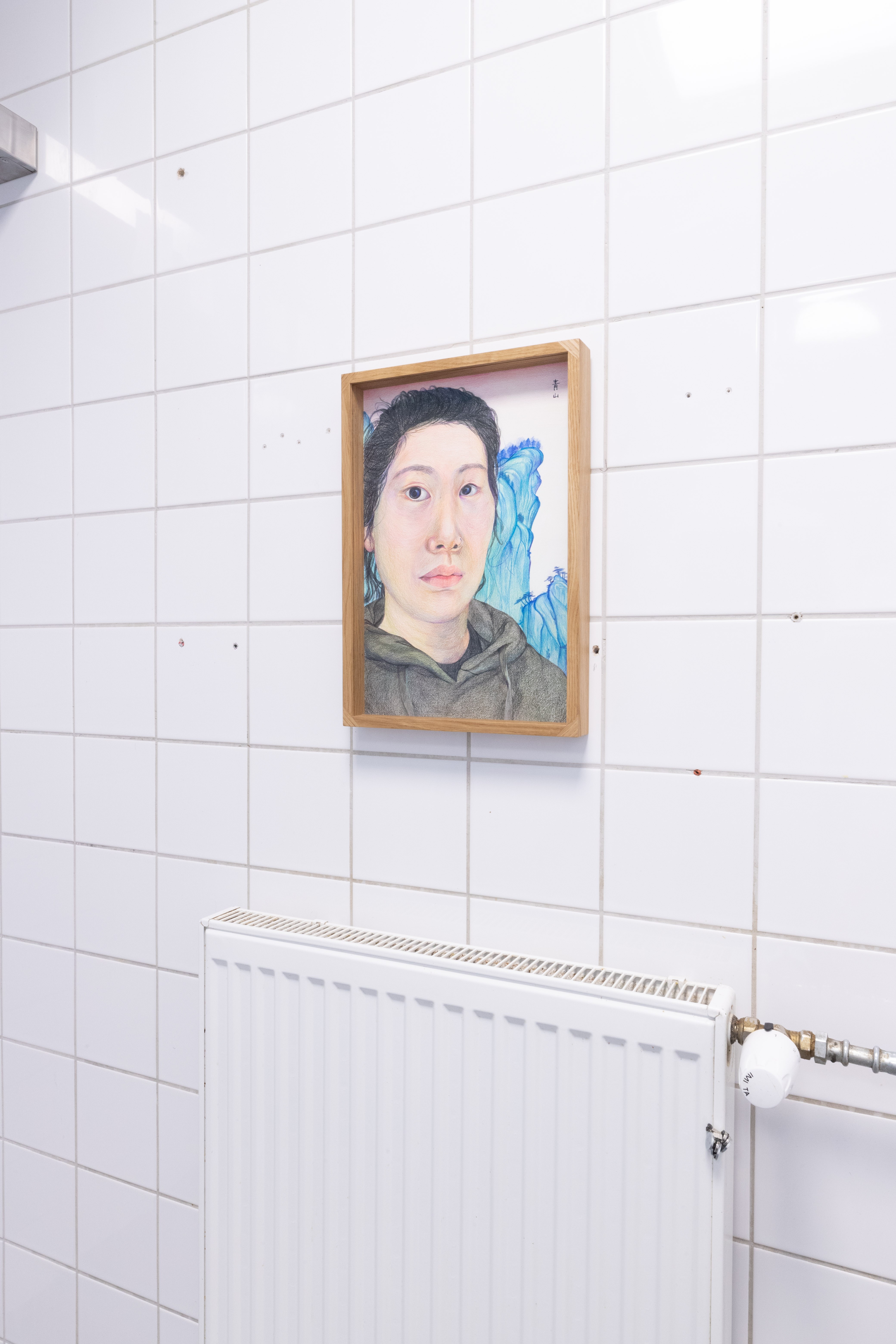 Pitted Dates: FOR SOMETHING TO BE FILLED, Minjee Hwang Kim: Self-Portrait with Blue Mountains, coloured pencil and ink on paper, oak, museum glass, Custom-made frame by Ville Arpiainen, 297x420mm, 2023