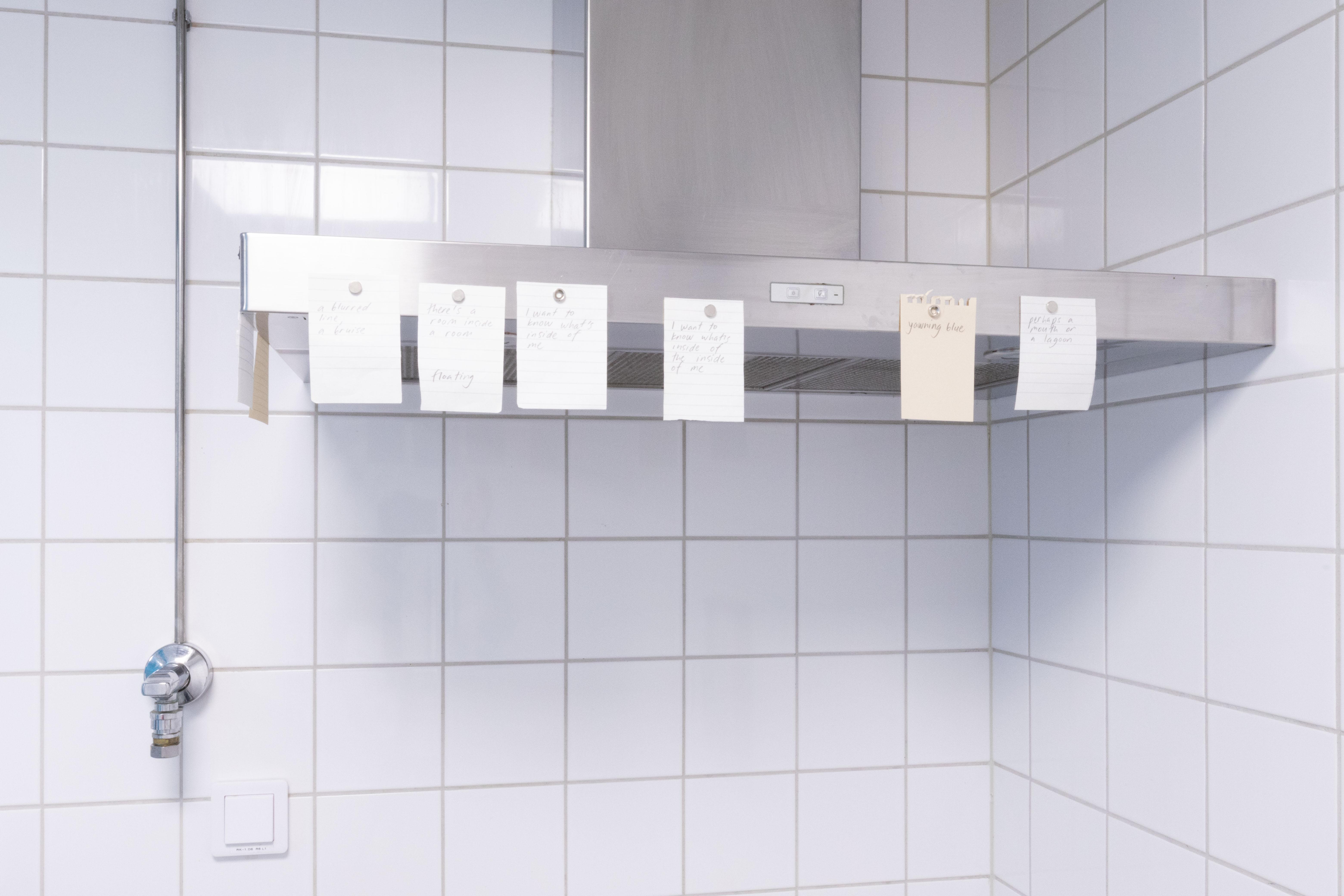 Pitted Dates: FOR SOMETHING TO BE FILLED, Maarit Mustonen: a commissioned poem, pencil on paper, magnets, 8 x 7x10cm, 2023