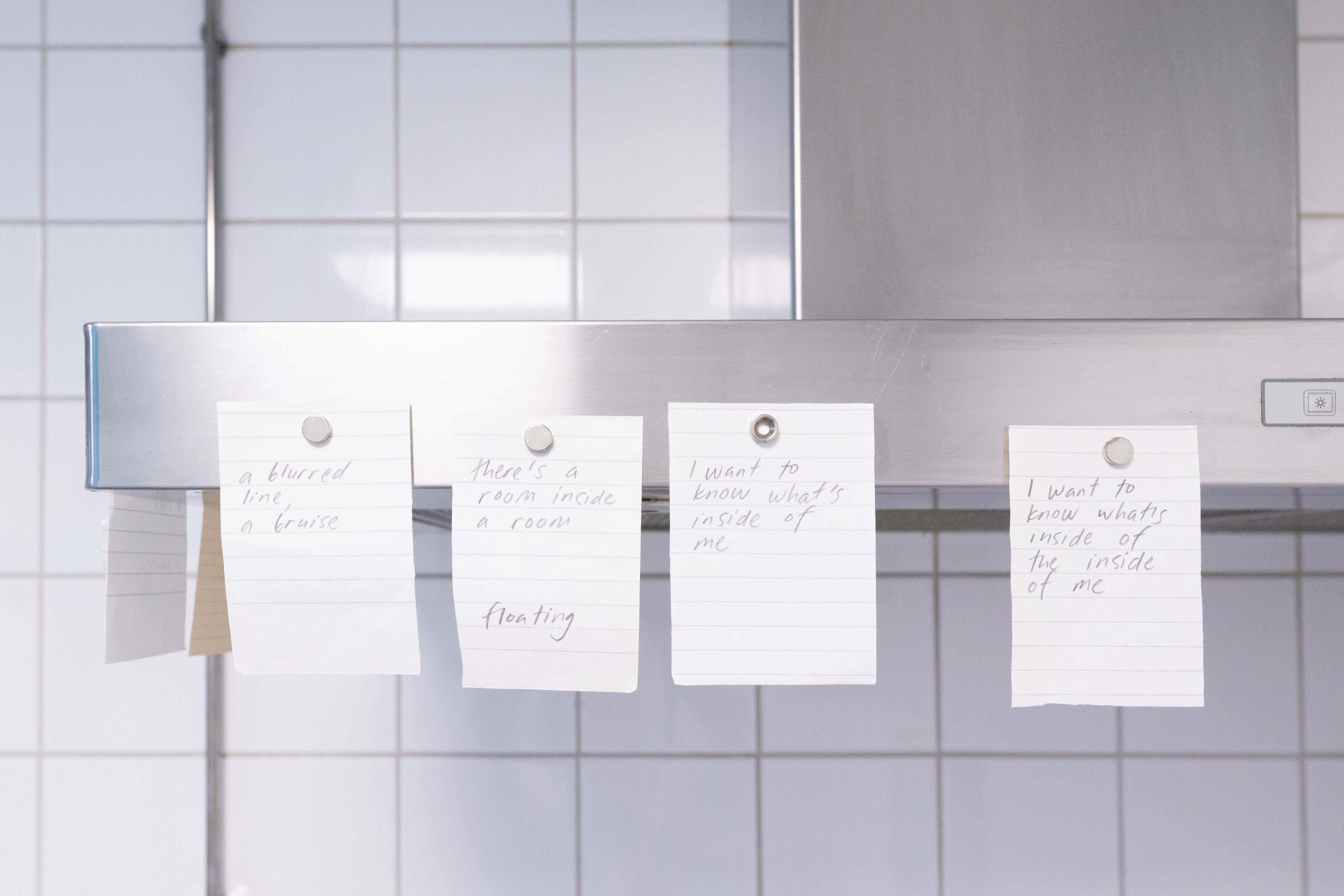 Pitted Dates: FOR SOMETHING TO BE FILLED, Maarit Mustonen: a commissioned poem, pencil on paper, magnets, 8 x 7x10cm, 2023