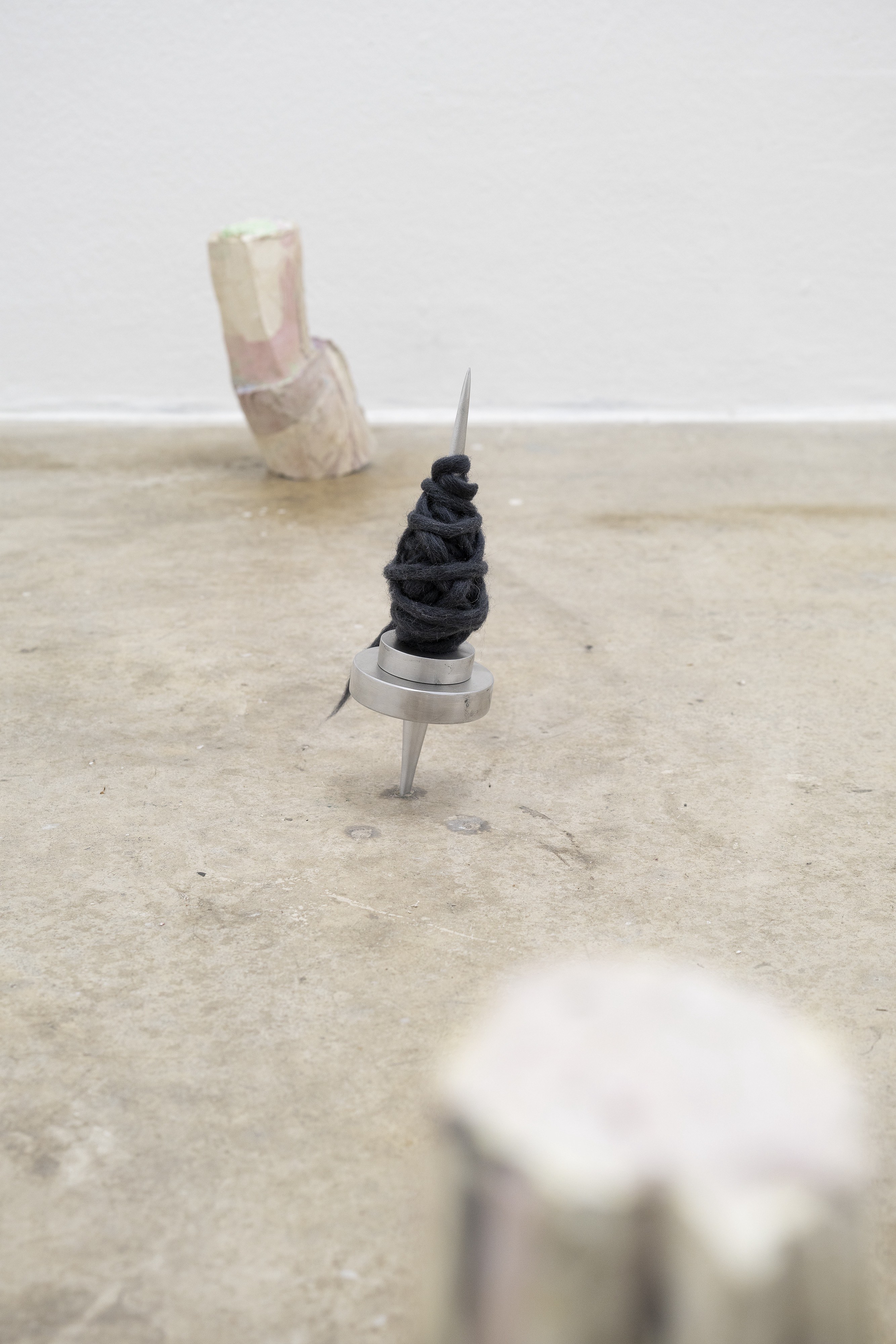 Installation View, center: spinsterâ€™s bishop by Elektra Stampoulou, aluminium, wool, velvet, olfactory components, 93x17cm, 12x5cm, 2023 top/bottom: just do it by gousgous, cement, pigments, wire, various sizes, 2023