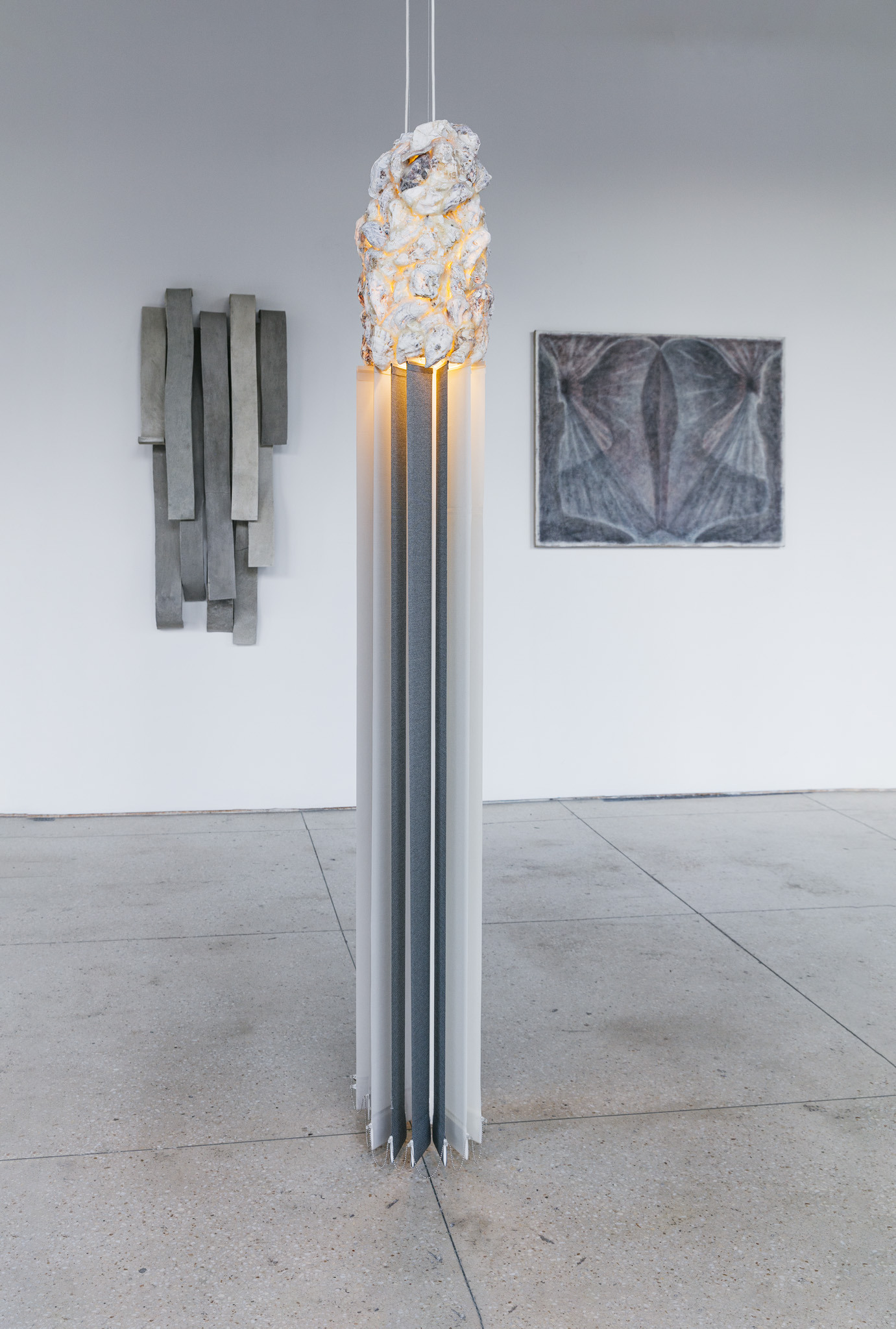 Agata Ingarden, M, 2020, plastic window model, double-sided mirror, oyster shells, window blinds, copper wire, UV neon light, warm-white neon light, electrical wiring, painted steel, mosquito net, 73 x 68 x 58 cm