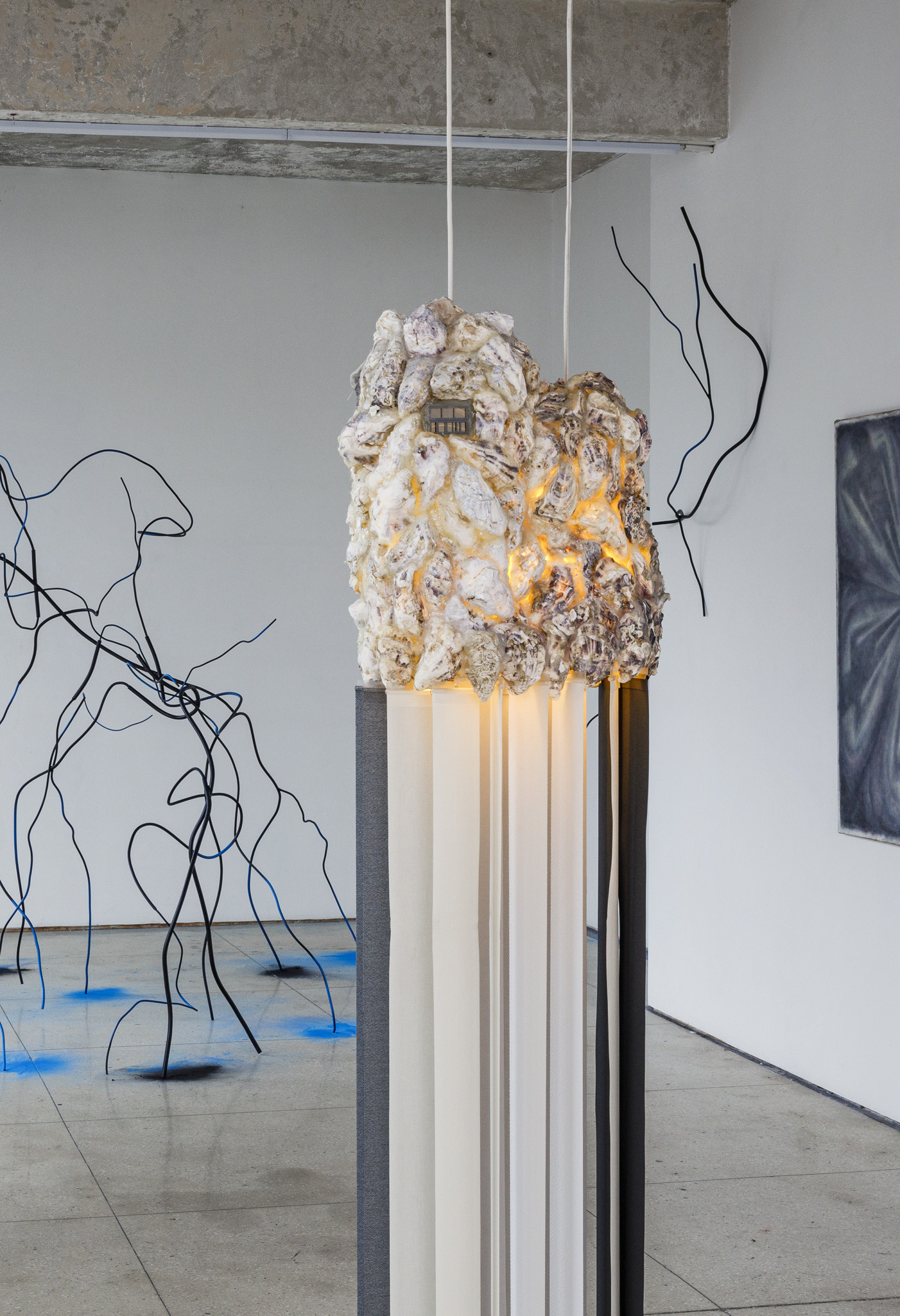 Agata Ingarden, H, 2020, plastic window model, double-sided mirror, oyster shells, window blinds, copper wire, UV neon light, cool-white neon light, electrical wiring, painted steel, mosquito net, 56 x 50 x 83 cm