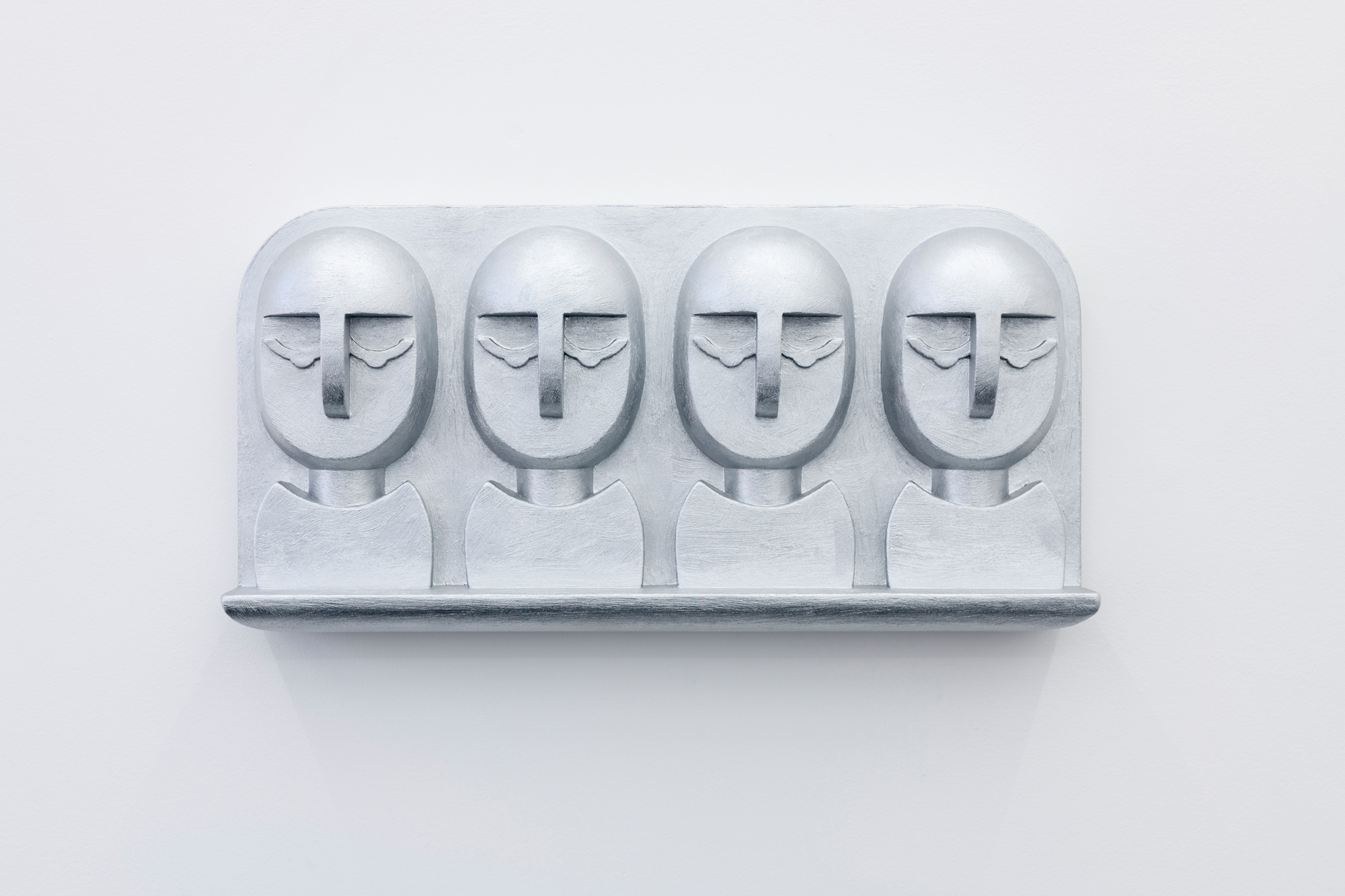 NICK EVANS, Sleeping Heads, 2023, Polymer gypsum with silver paint, 29 x 58 x 10 cm