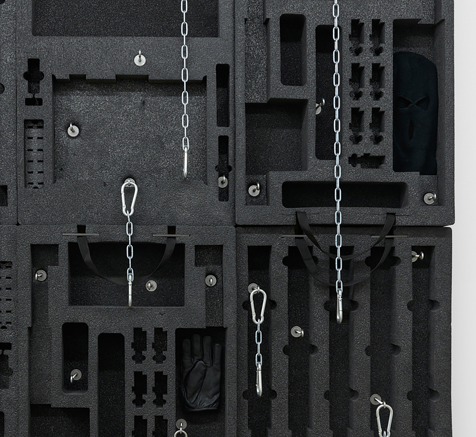 Joe Bartram Constellation, 2022 (detail) Pelican case inserts, stainless steel chain, snap links,  miscellaneous hardware, wood, ski mask, Maglite, leather glove 72 x 68 x 8 inches (183 x 173 x 20 cm)