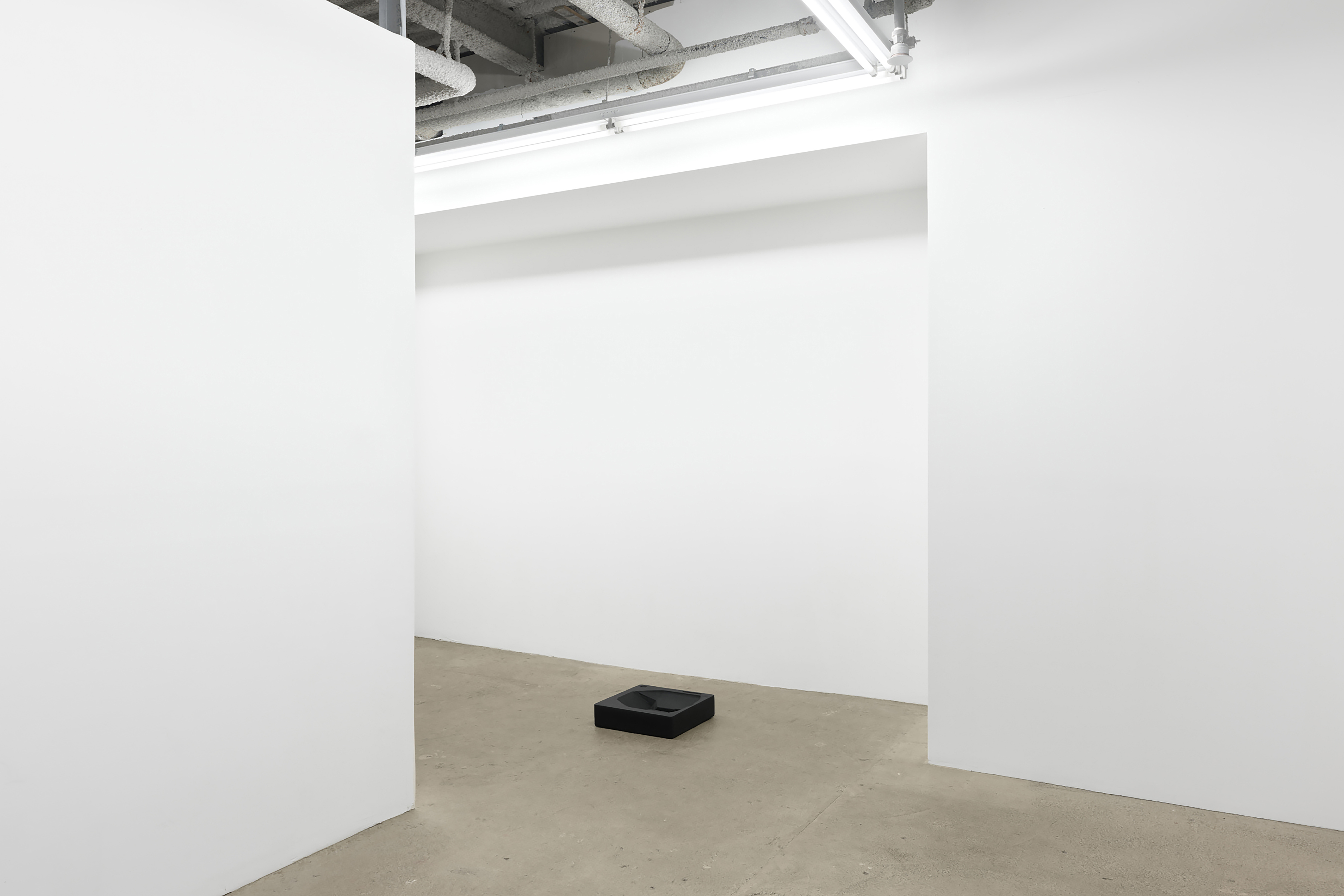 Joe Bartram EPS_3, 2023 cast polymer modified gypsum, fiberglass, dye, graphite, urethane foam 18 x 18 x 6 inches (46 x 46 x 15 cm) or 6 x 18 x 18 inches (15 x 46 x 46 cm)